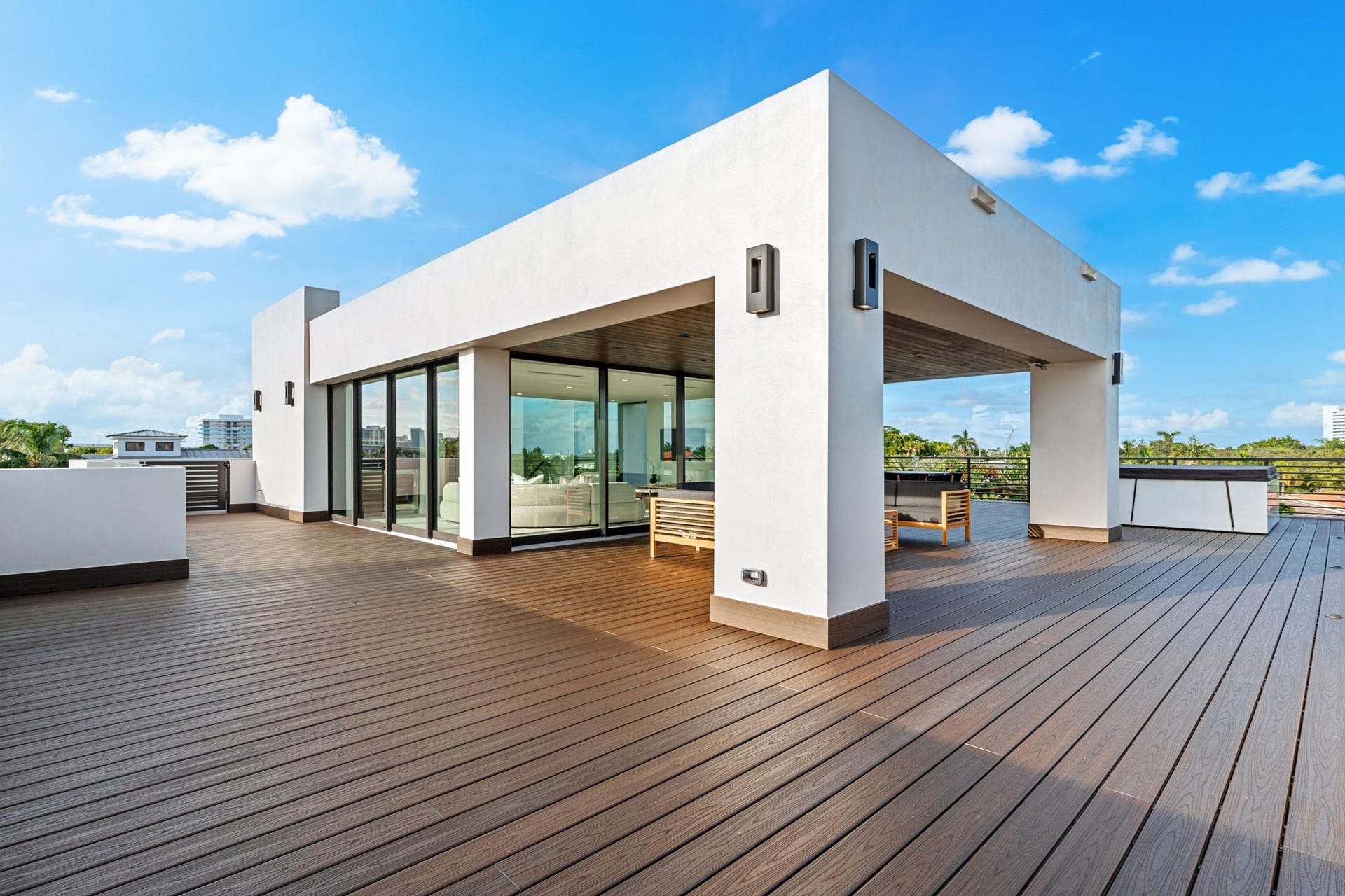 2000 Harbourview Drive, Fort Lauderdale, FL 33316 A striking rooftop-level pavilion set upon expansive wood decking, defined by clean architectural lines and floor-to-ceiling glass. Bold and contemporary, this elevated outdoor living space offers endless possibilities for sophisticated entertaining under open skies.