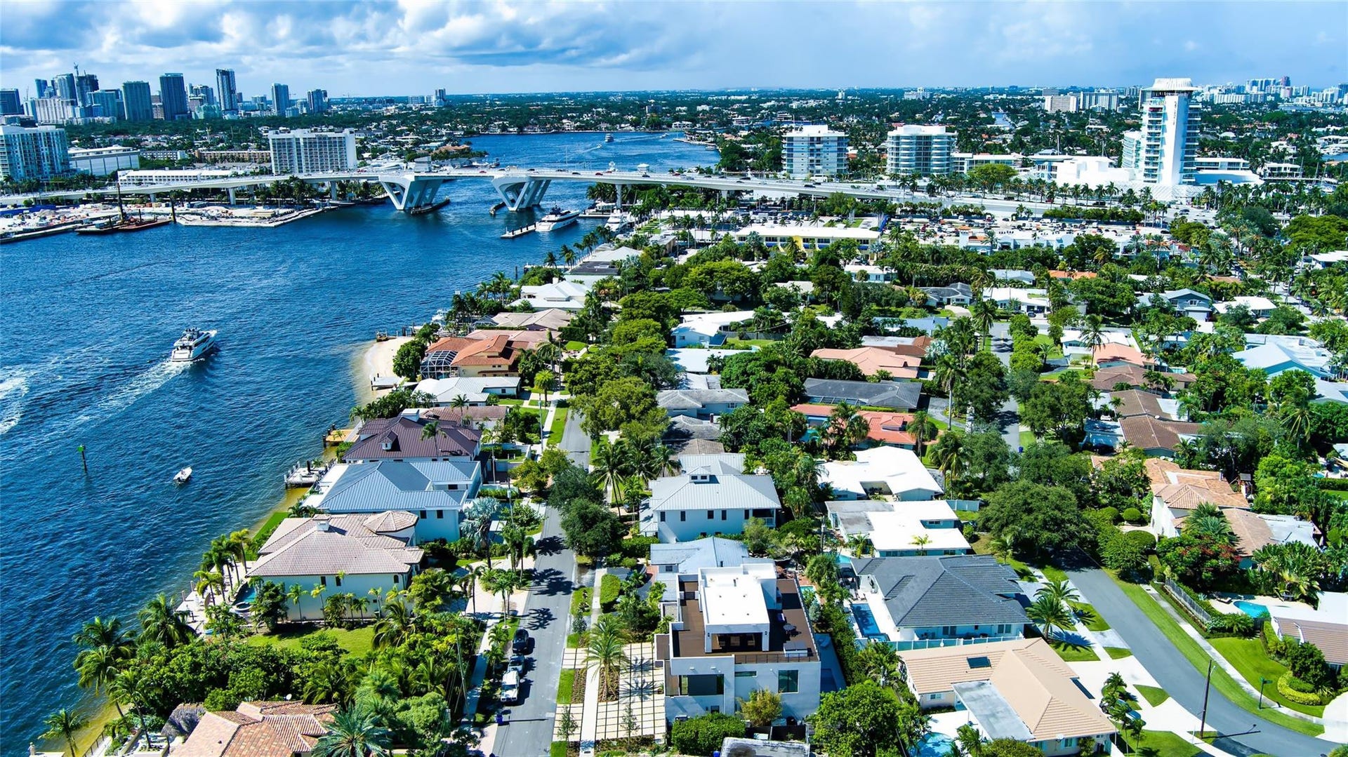 2000 Harbourview Drive, Fort Lauderdale, FL 33316 A breathtaking aerial perspective showcasing the neighborhoods prime waterfront location along the Intracoastal, with the Fort Lauderdale skyline rising in the distance. Perfectly positioned near beaches, marinas, and Las Olas Boulevard, this setting embodies the very best of coastal luxury living.