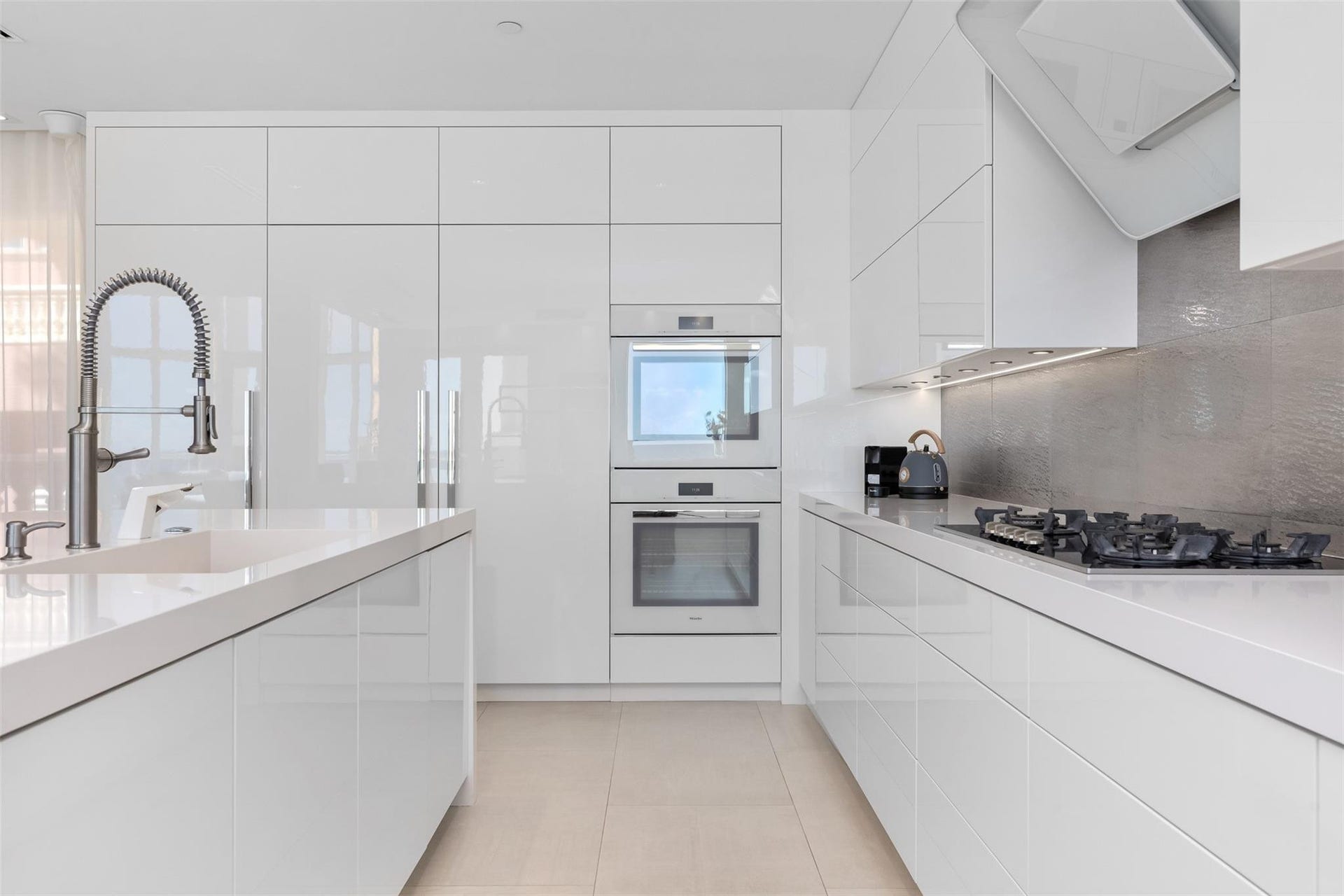 2140 N Ocean Boulevard, #V, Fort Lauderdale, FL 33305 Miele 5 burner gas stove with dual ovens, microwave, Sub-Zero Refrigerator and freezer, Uline Wine Cooler!