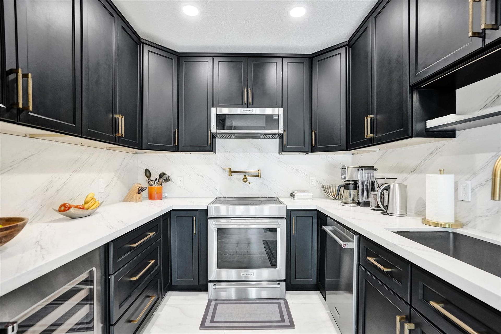 Chefs kitchen with quartz counters, custom cabinetry, and premium appliances.