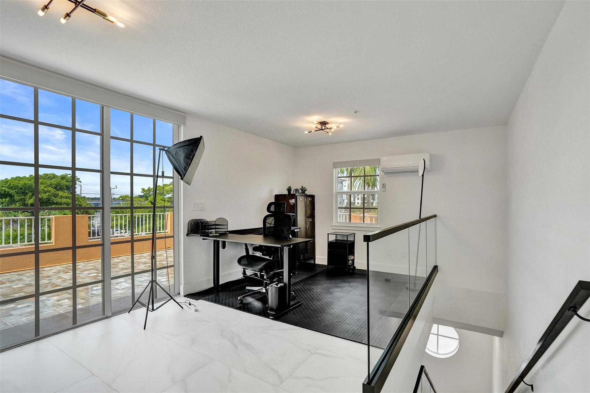 Loft/flex space leading to rooftop terrace.
