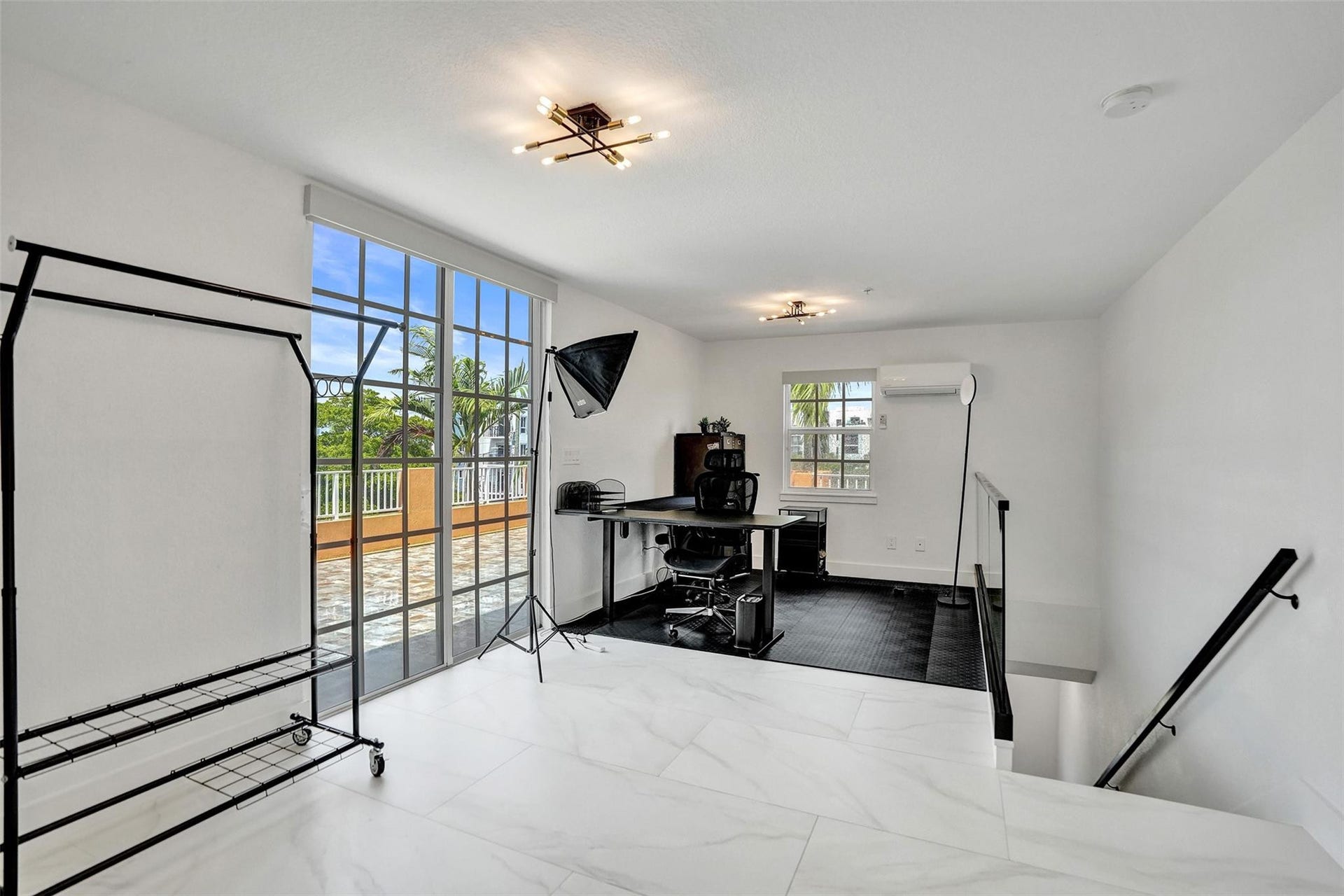 Loft/flex space leading to rooftop terrace.
