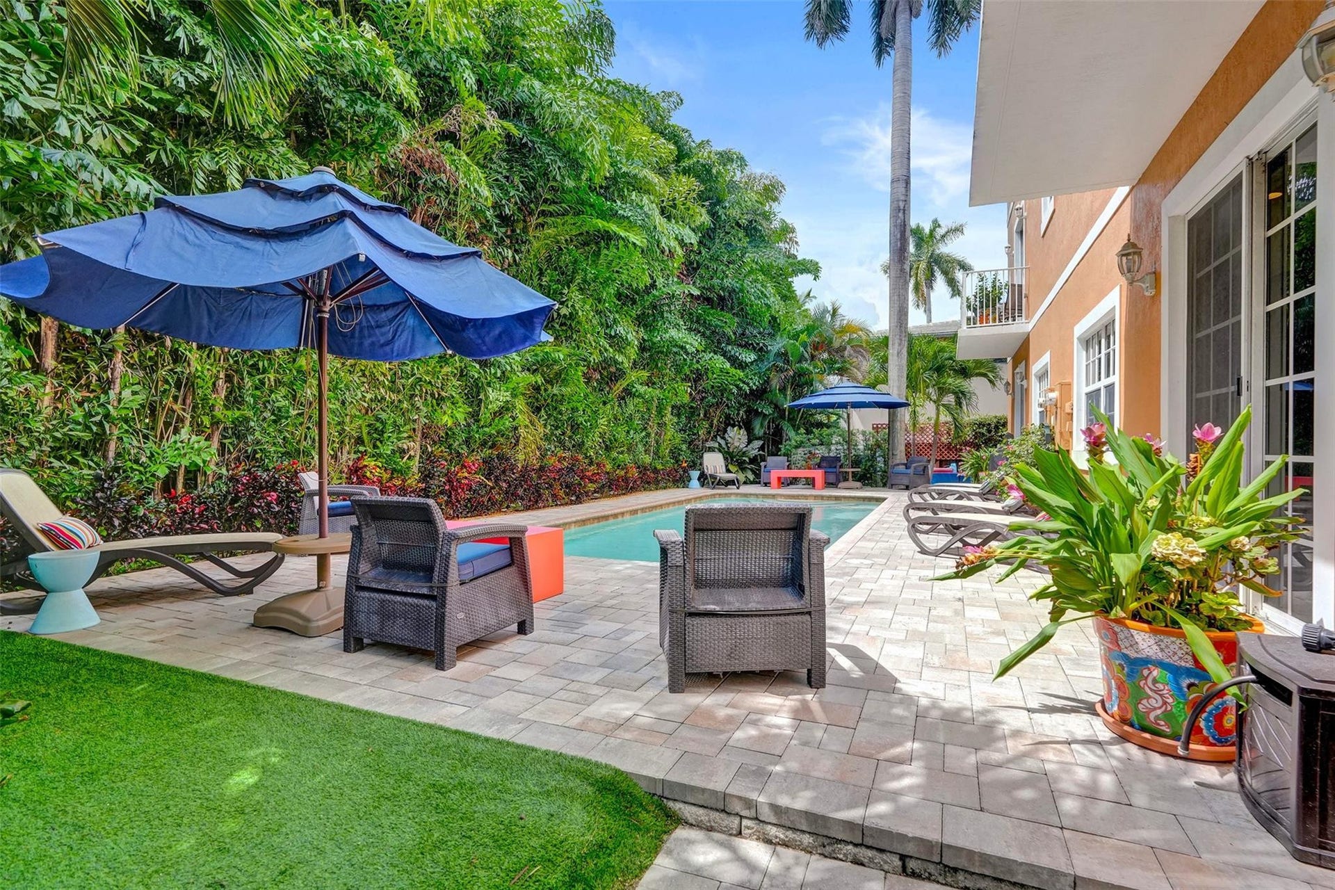 Community pool with lush landscaping for privacy.