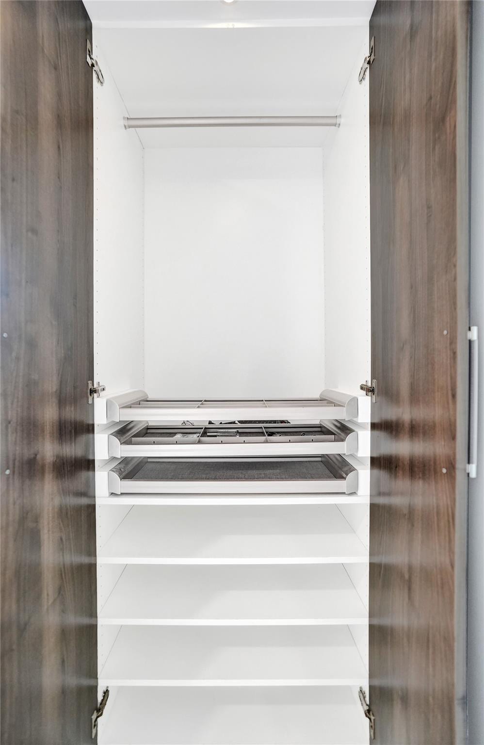 Custom walk-in closet with built-ins.