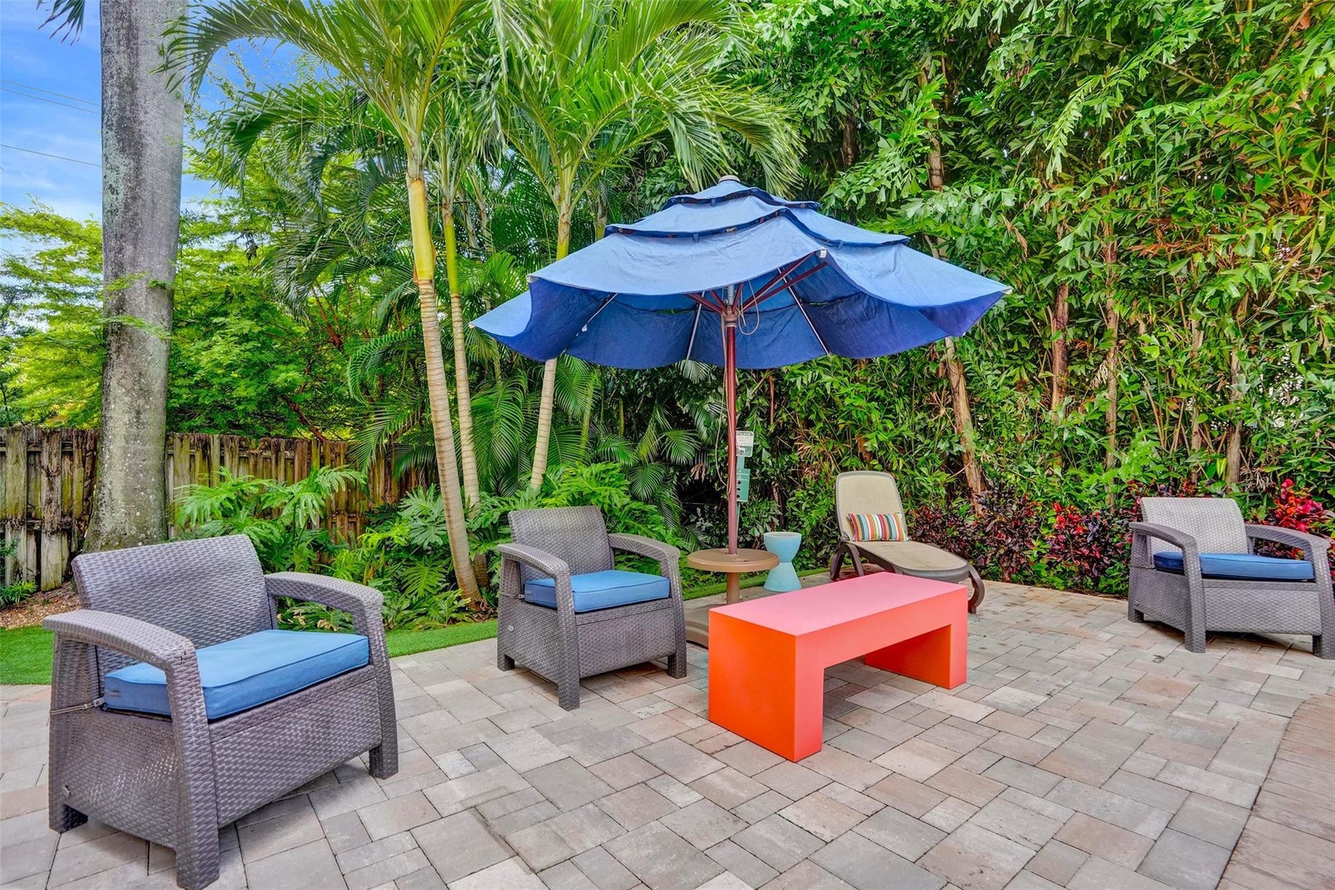 Community pool with lush landscaping.