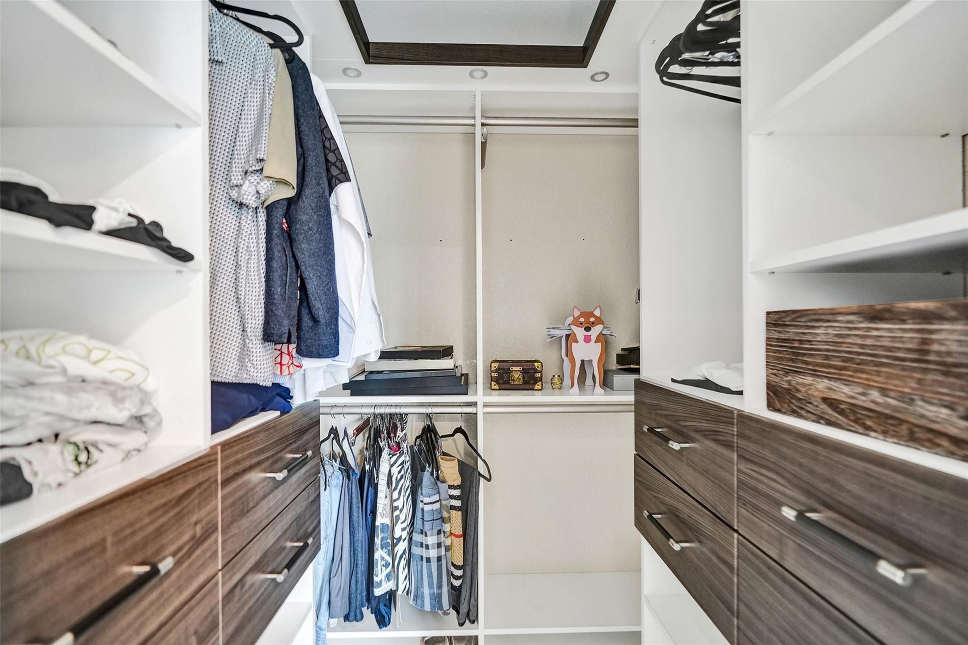 Custom walk-in closet with built-ins.