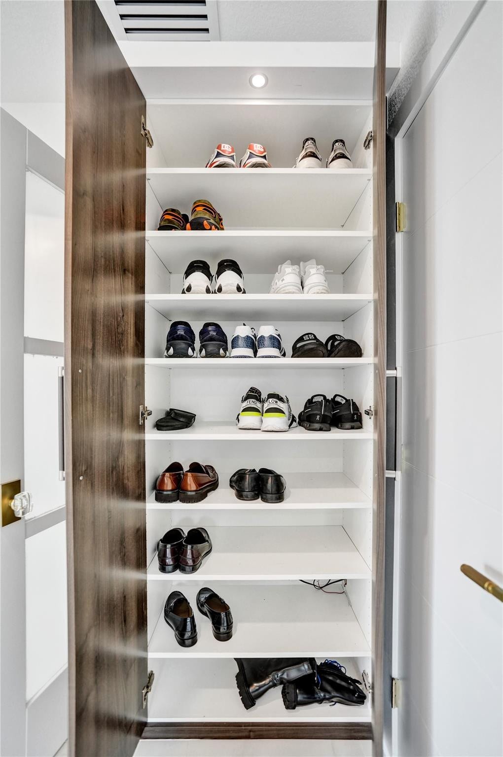 Custom walk-in closet with built-ins.