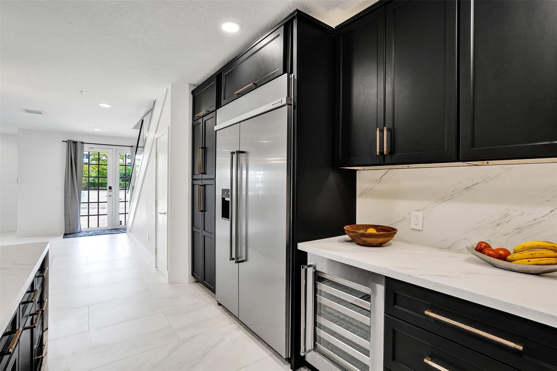 Chefs kitchen with quartz counters, custom cabinetry, and premium appliances.