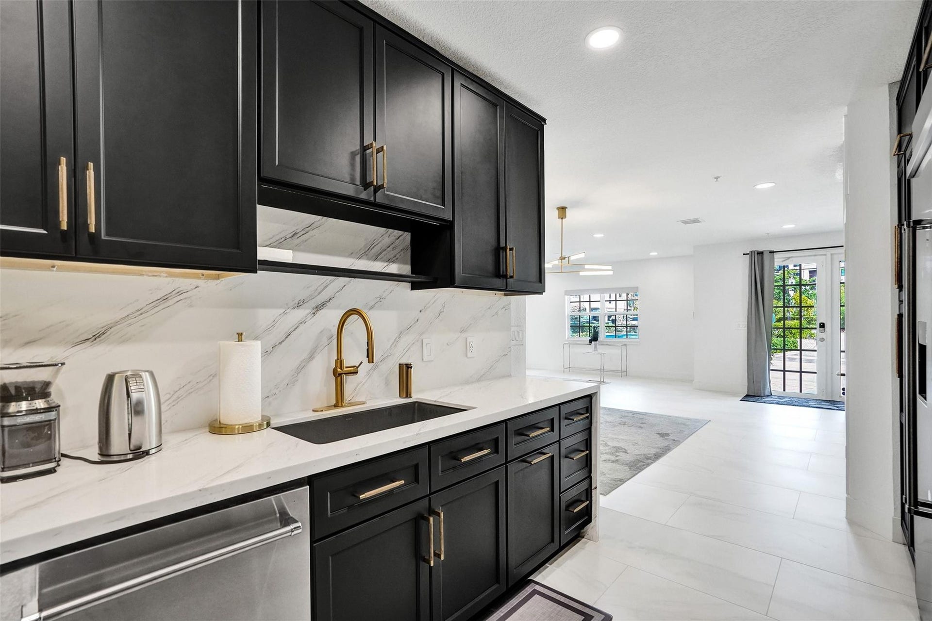 Chefs kitchen with quartz counters, custom cabinetry, and premium appliances.