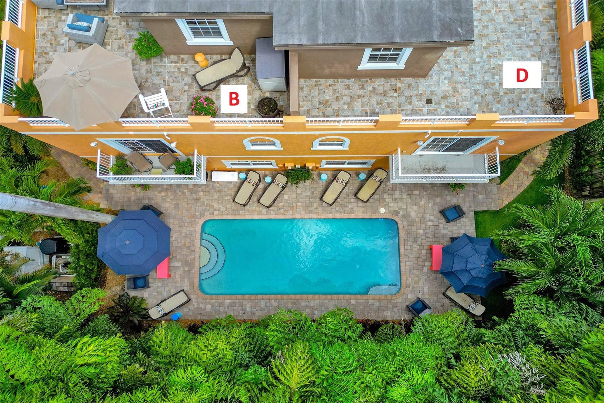 Community pool with lush landscaping.