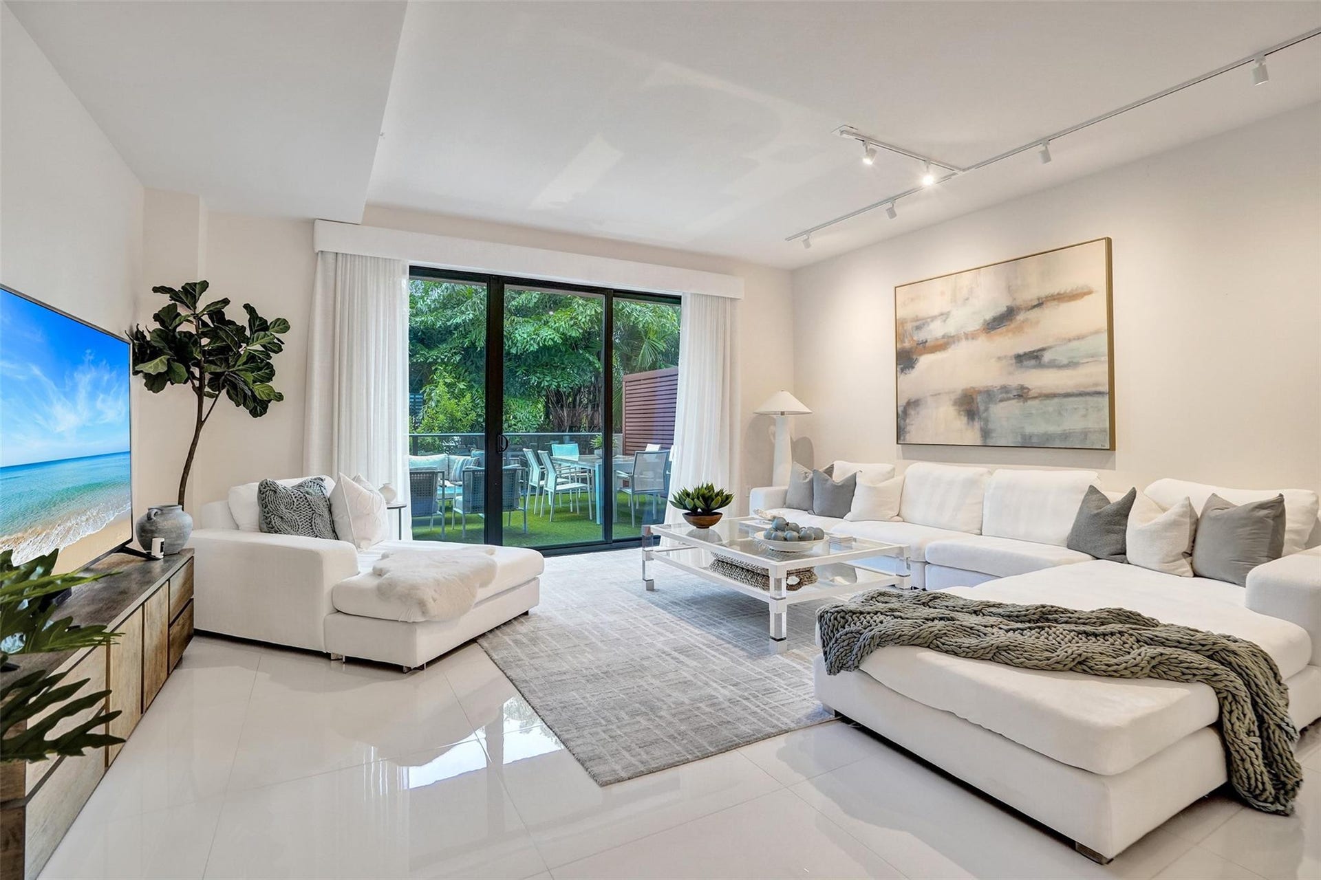 3030 N Ocean Boulevard, #S104, Fort Lauderdale, FL 33308 large living space with lush green views
