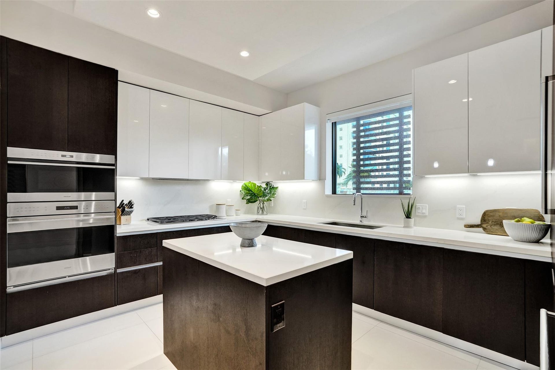 3030 N Ocean Boulevard, #S104, Fort Lauderdale, FL 33308 tuxedo style Italian cabinetry- espresso lowers & white lacquer uppers