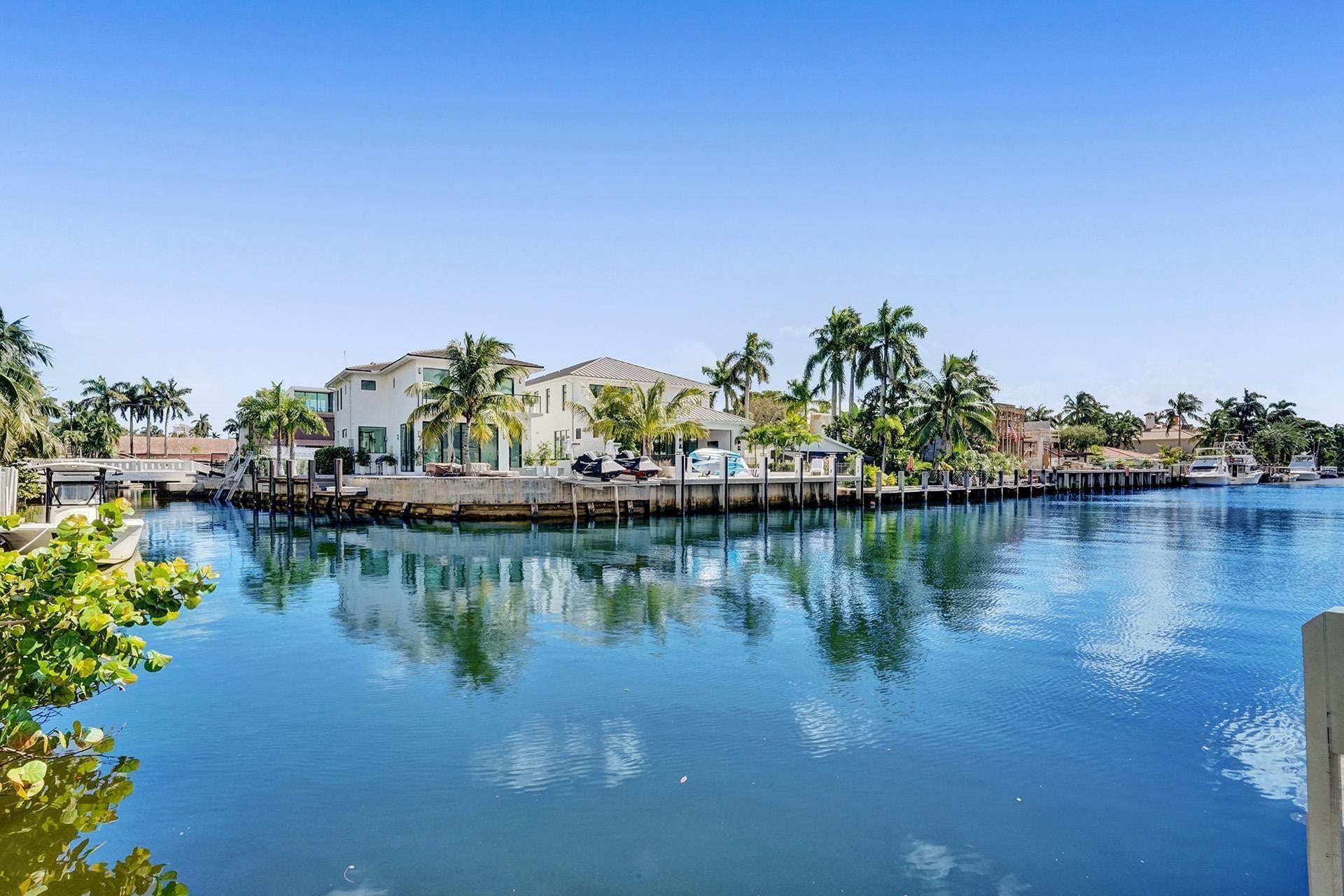 FROM THE POOL-SIDE, ENJOY THE MULTI-MILLION- DOLLAR MANSIONS SURROUNDING YOU.