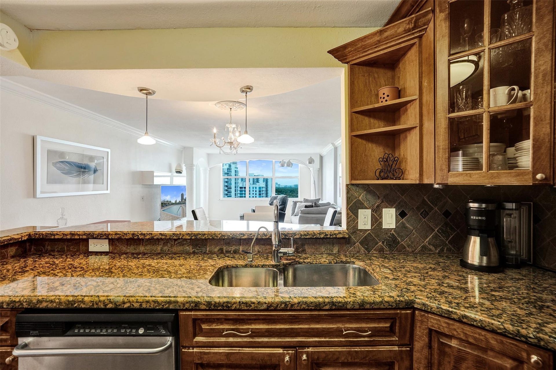 3015 N Ocean Boulevard, #15J, Fort Lauderdale, FL 33308 Open kitchen invites conversation among guests