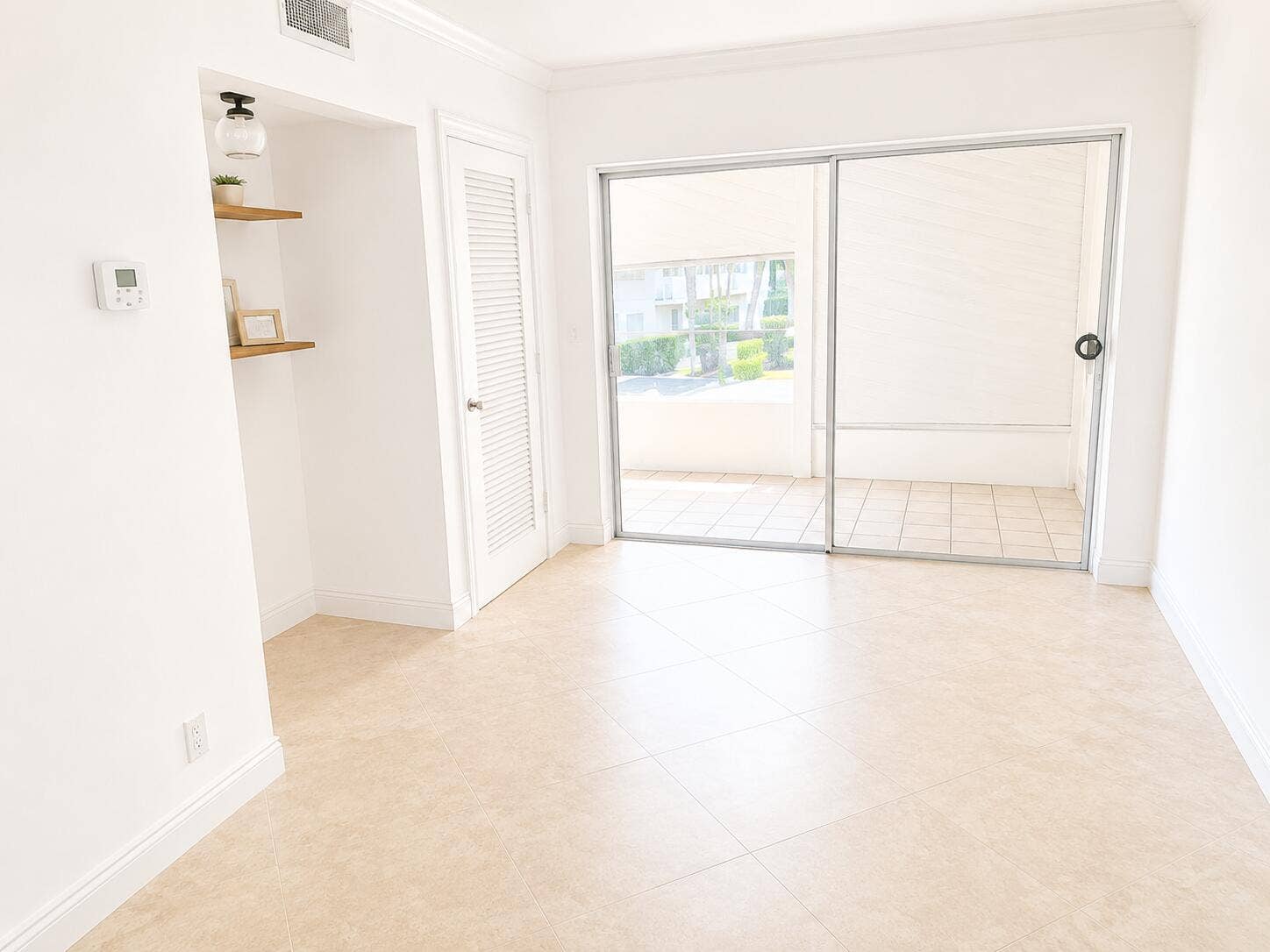 large living area leads out to patio- this could be 2nd bedroom
