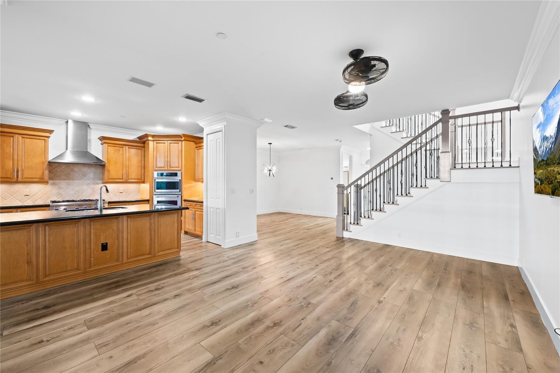 218 NE 15th Avenue, #218, Fort Lauderdale, FL 33301 Entertainment area with view of kitchen and stairs