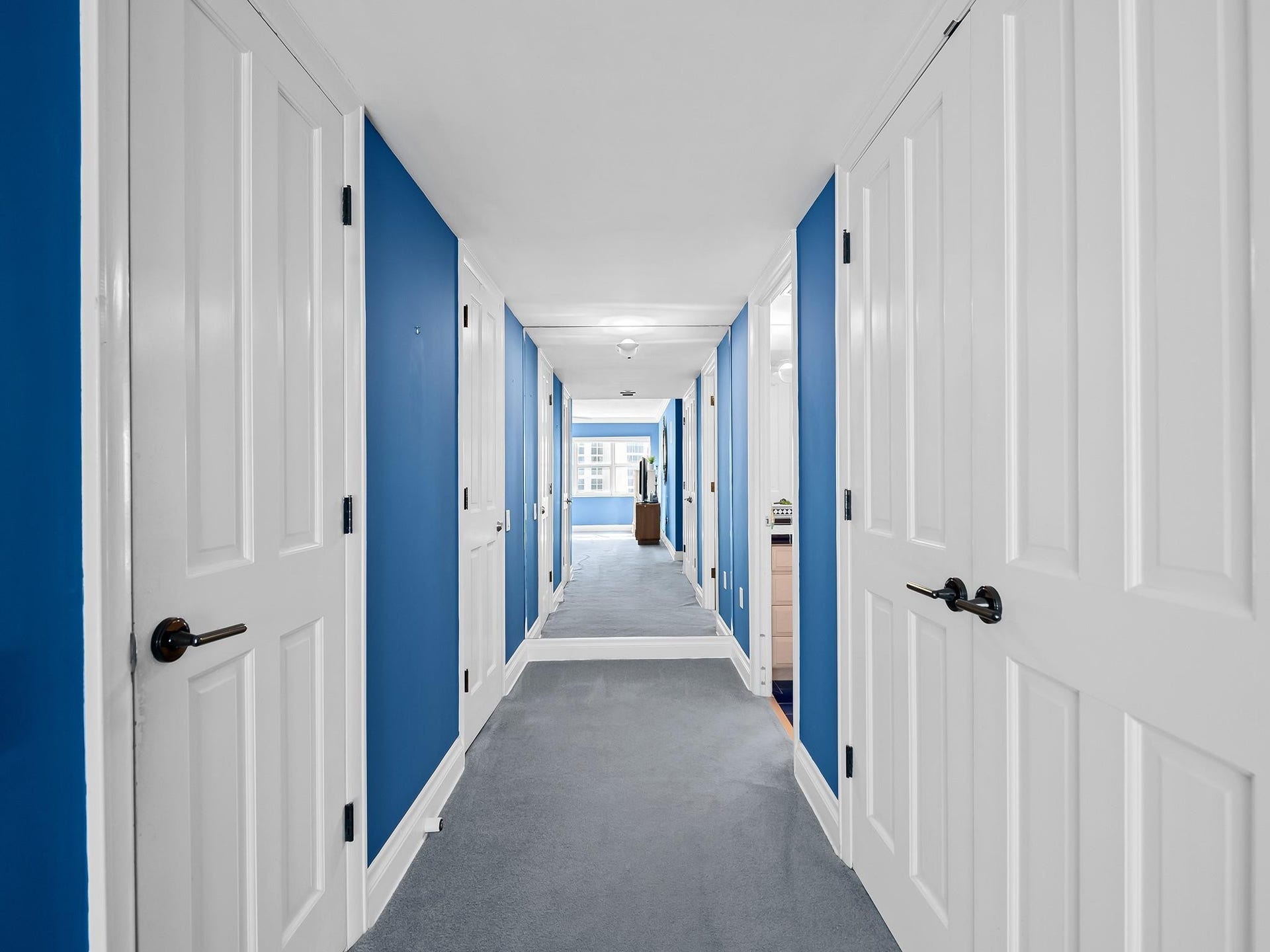 3400 Galt Ocean Drive, #1202S, Fort Lauderdale, FL 33308 Primary suite hall to primary bath (note: wall mirror at the end of hall makes the hall look long)