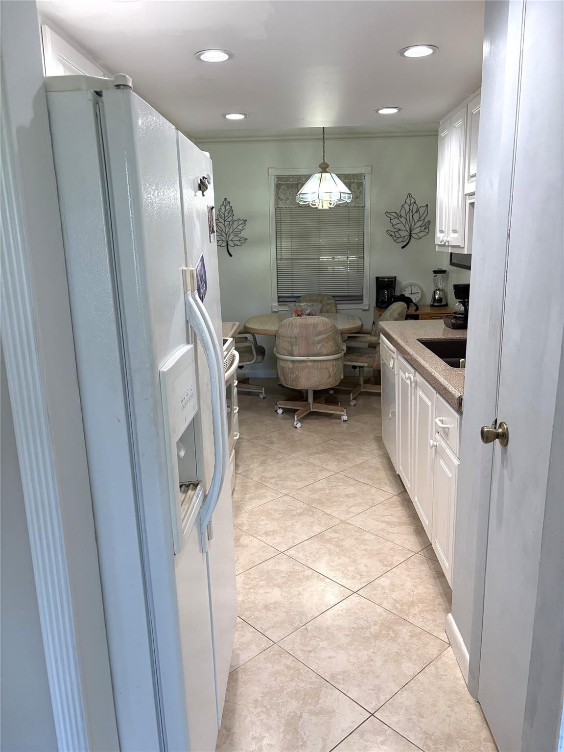 620 Tennis Club Drive, #105, Fort Lauderdale, FL 33311 Open Kitchen from Living Room, with dining area beyond