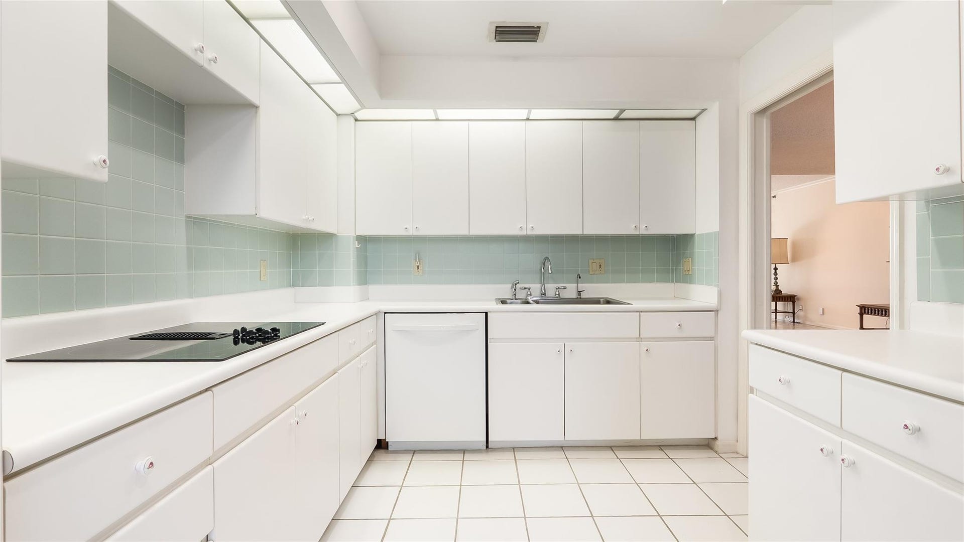 4116 W Palm Aire Drive, #165A, Pompano Beach, FL 33069 Large and functional white modern looking kitchen.