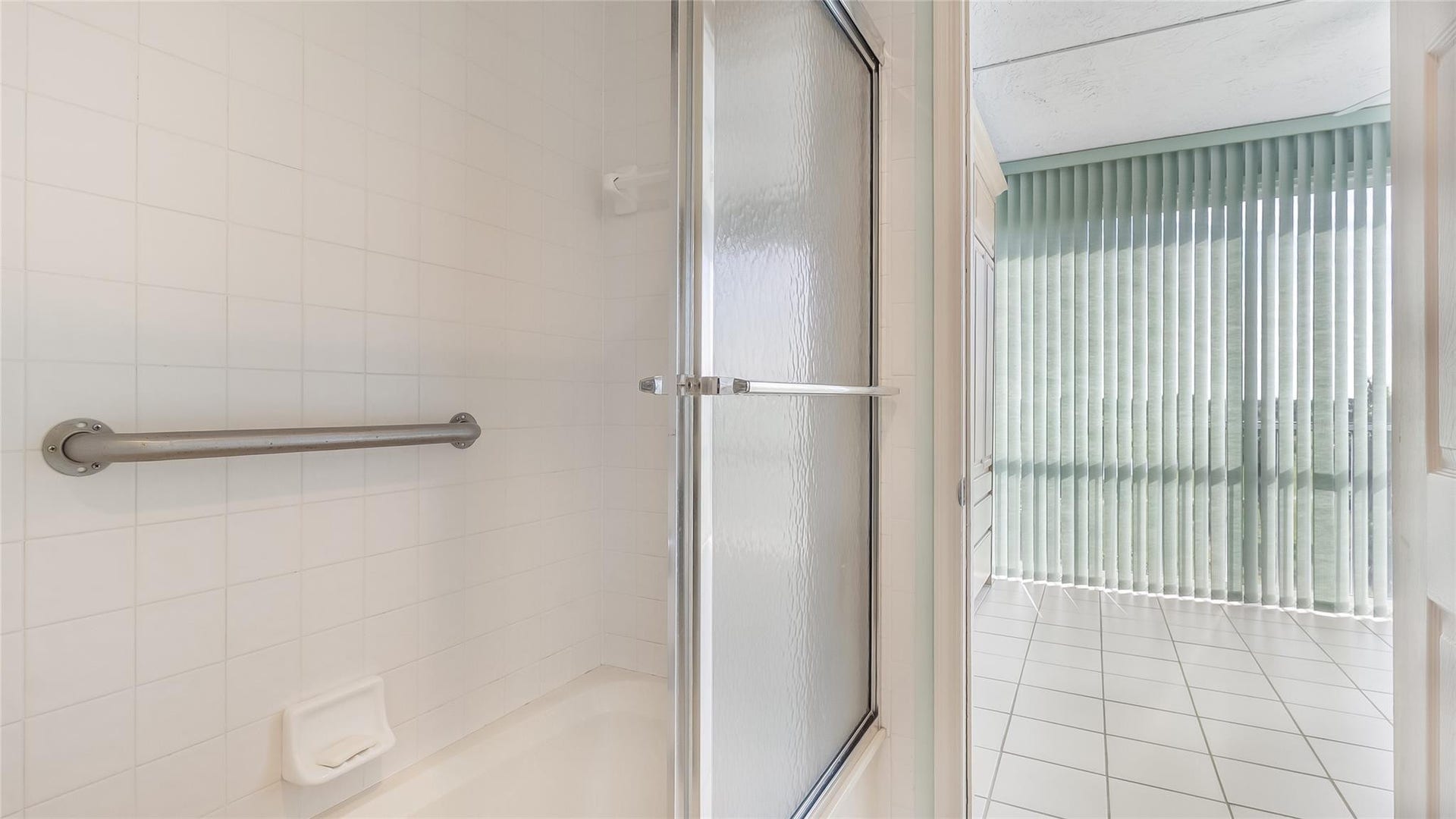 4116 W Palm Aire Drive, #165A, Pompano Beach, FL 33069 Bathroom leads to 2nd bedroom and enclosed balcony previoulsy used as a 3rd bedroom.