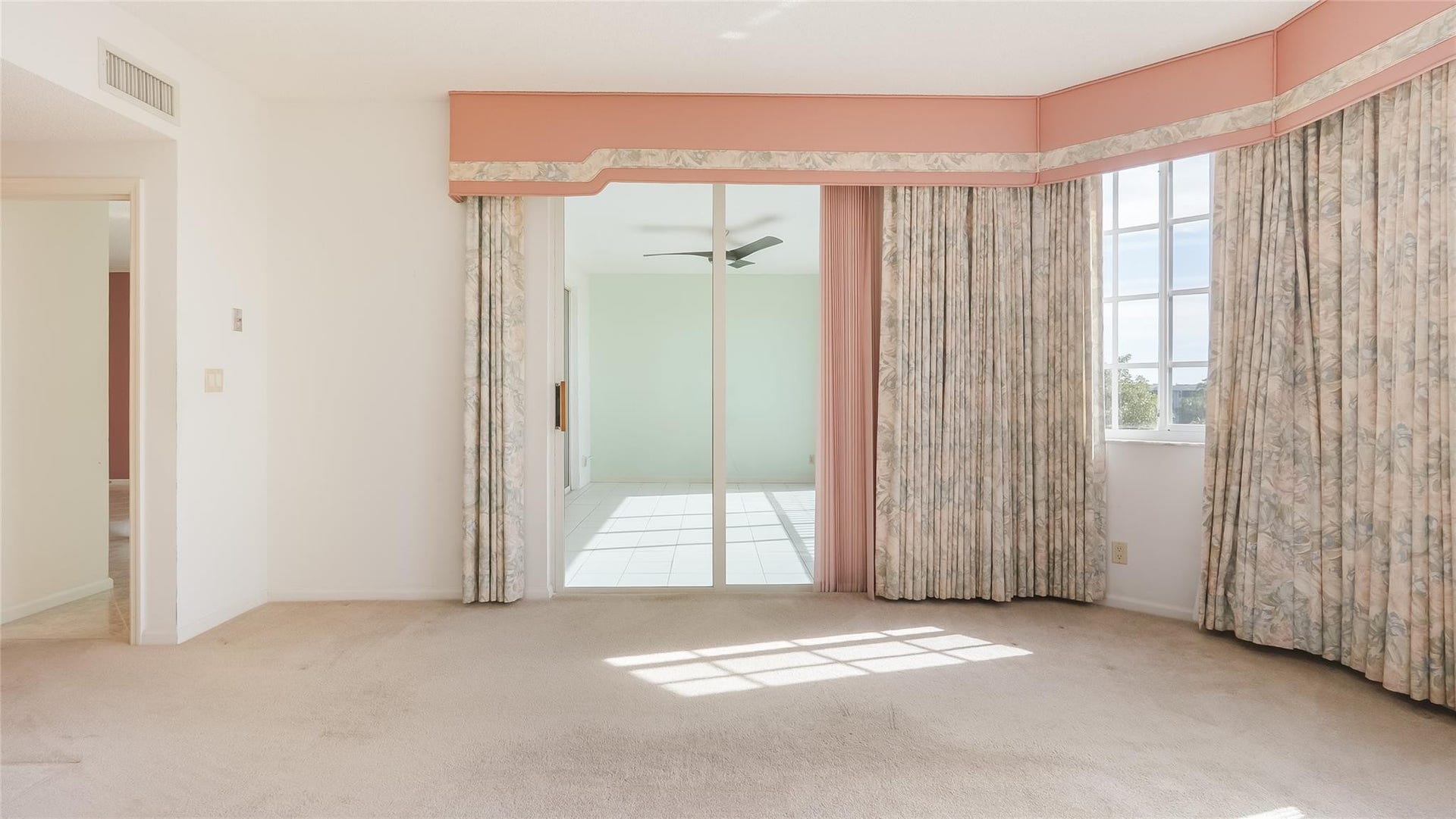 4116 W Palm Aire Drive, #165A, Pompano Beach, FL 33069 Primary bedroom with gold course views and access to enclosed balcony.