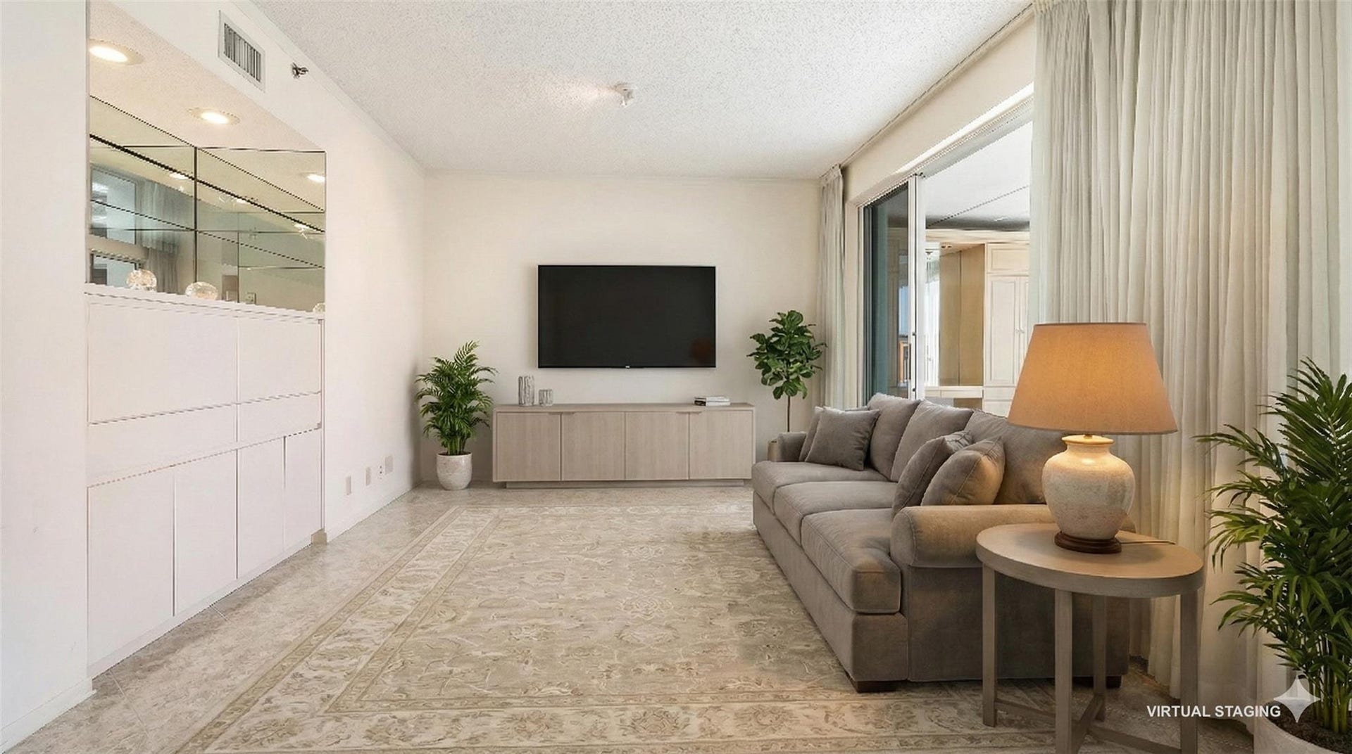 4116 W Palm Aire Drive, #165A, Pompano Beach, FL 33069 Bonus area off the vliving room with built in cabinets and bar area. Perfect confy tv area. (virtual staging)