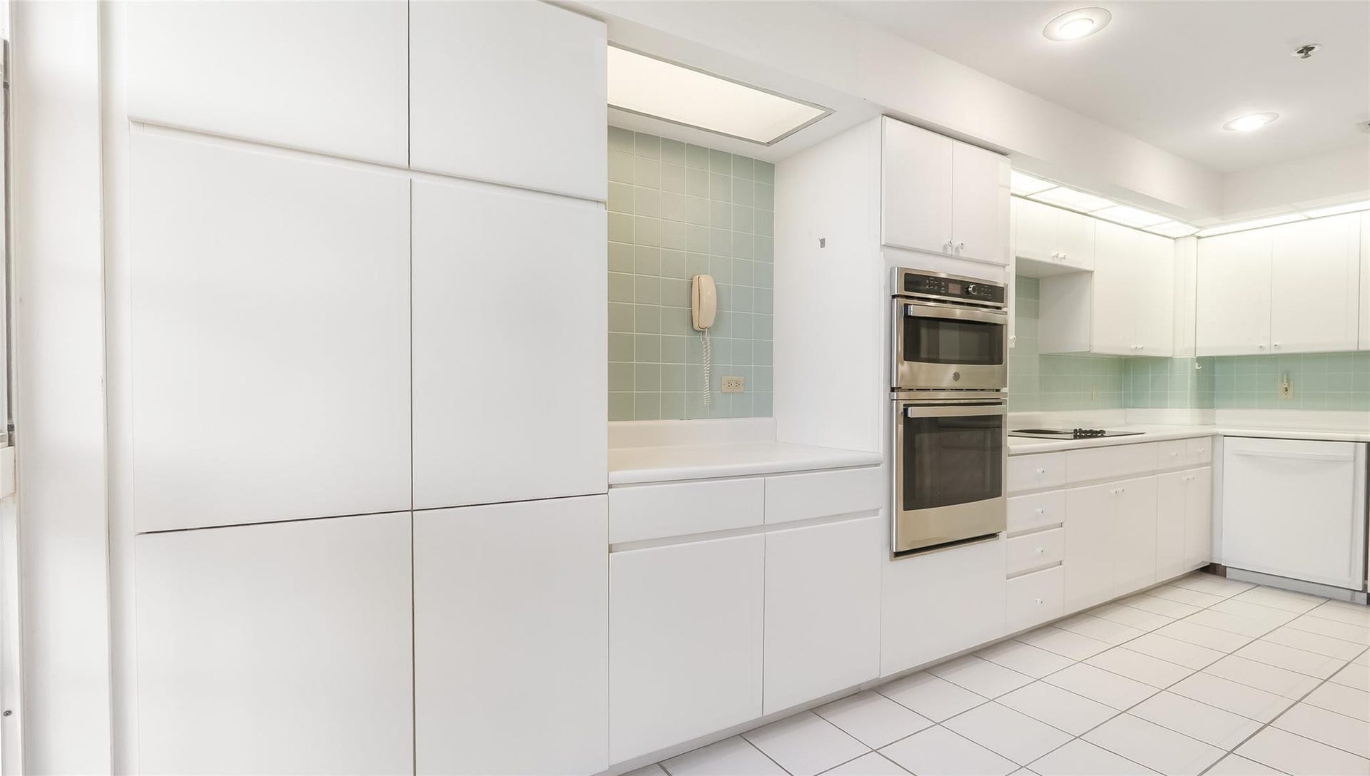 4116 W Palm Aire Drive, #165A, Pompano Beach, FL 33069 Large and functional white modern looking kitchen.