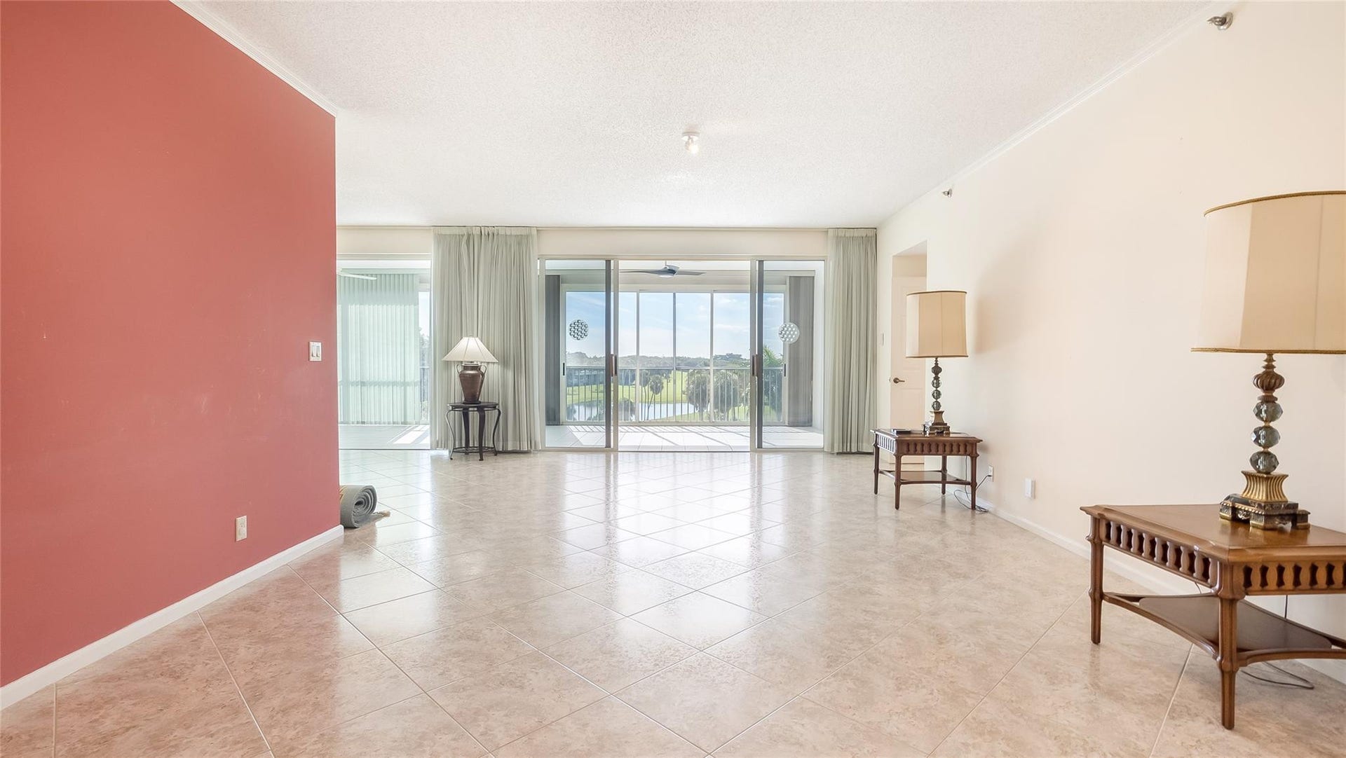 4116 W Palm Aire Drive, #165A, Pompano Beach, FL 33069 Living room facing the golf course.