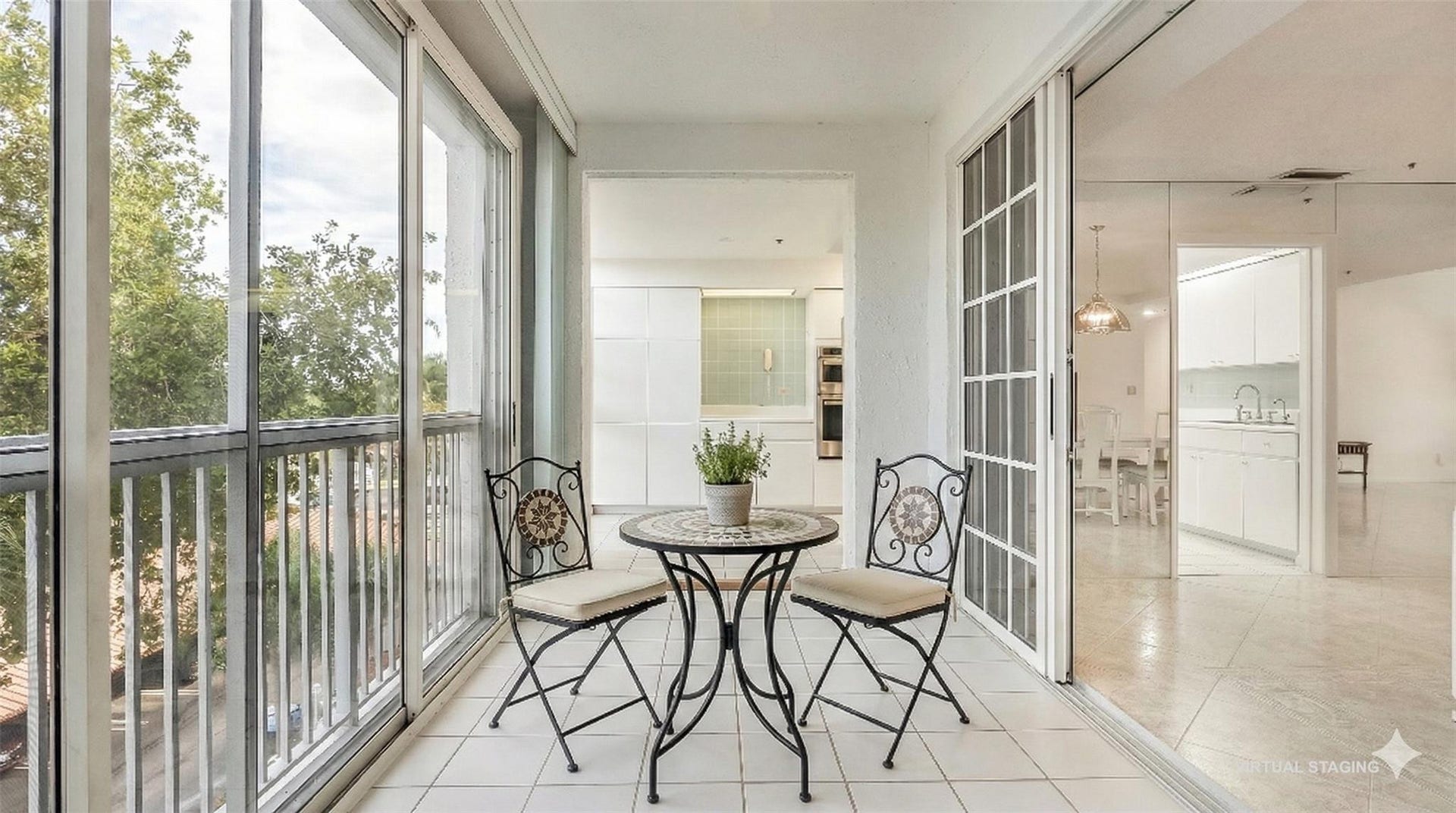 4116 W Palm Aire Drive, #165A, Pompano Beach, FL 33069 Enclosed balcony off of the kitchen and dining room make for a perfect breakfast room. (virtual staging)