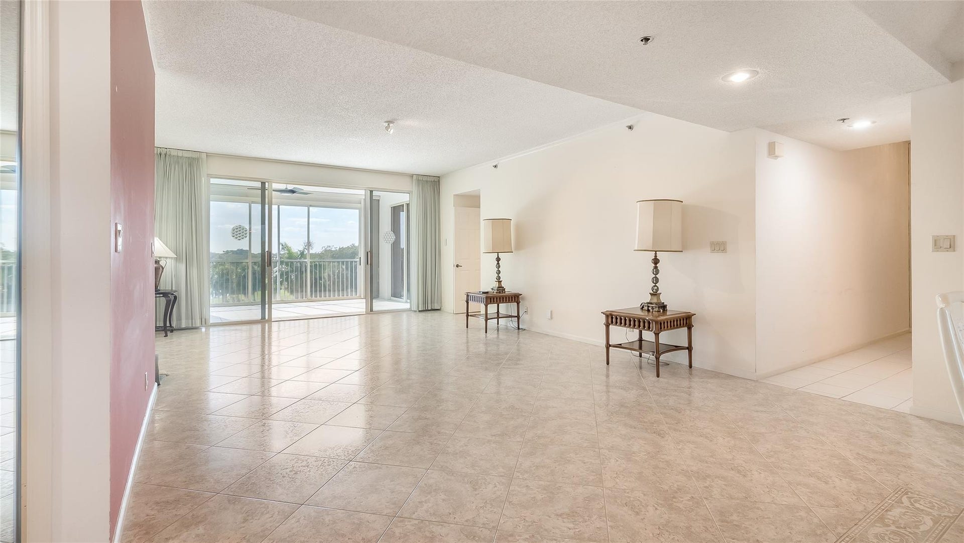 4116 W Palm Aire Drive, #165A, Pompano Beach, FL 33069 Living room facing the golf course.