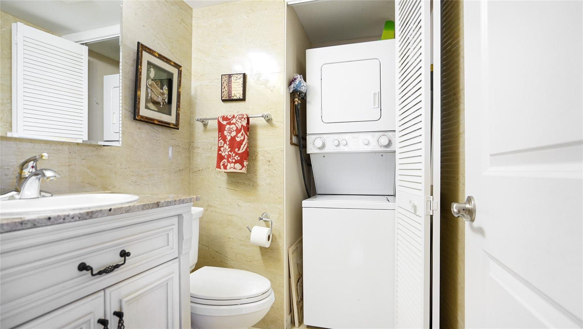 3410 Galt Ocean Drive, #802 N, Fort Lauderdale, FL 33308 The half bath houses the washer and dryer.