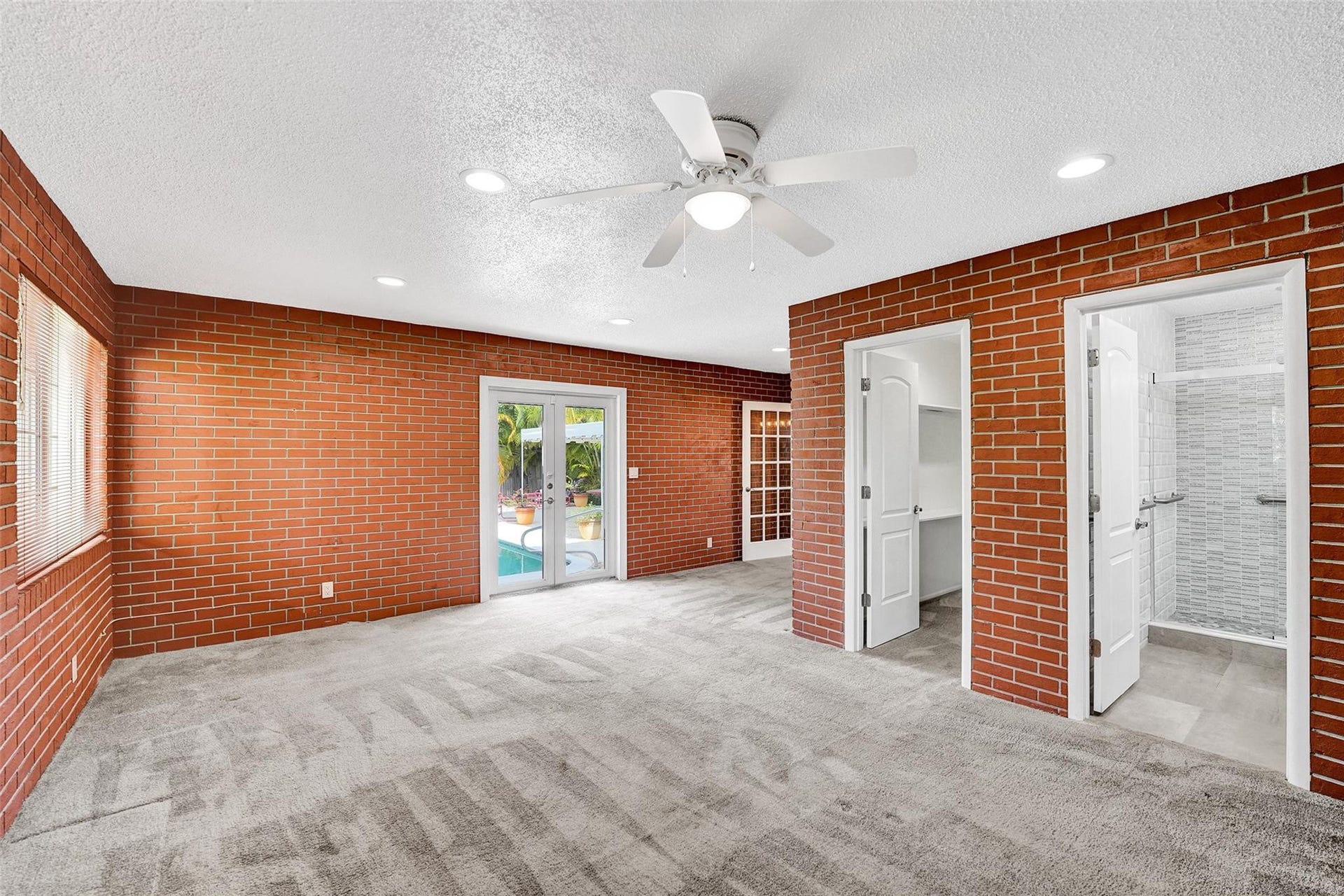 4731 NE 13 Avenue, Oakland Park, FL 33334 Huge third bedroom/in-law suite with double doors to pool area.