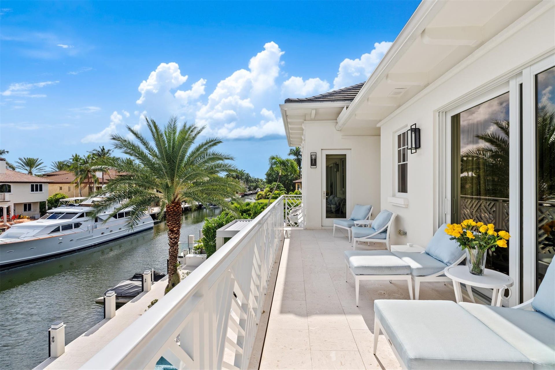 Upstairs balcony overlooking the water, connected to primary bedroom.