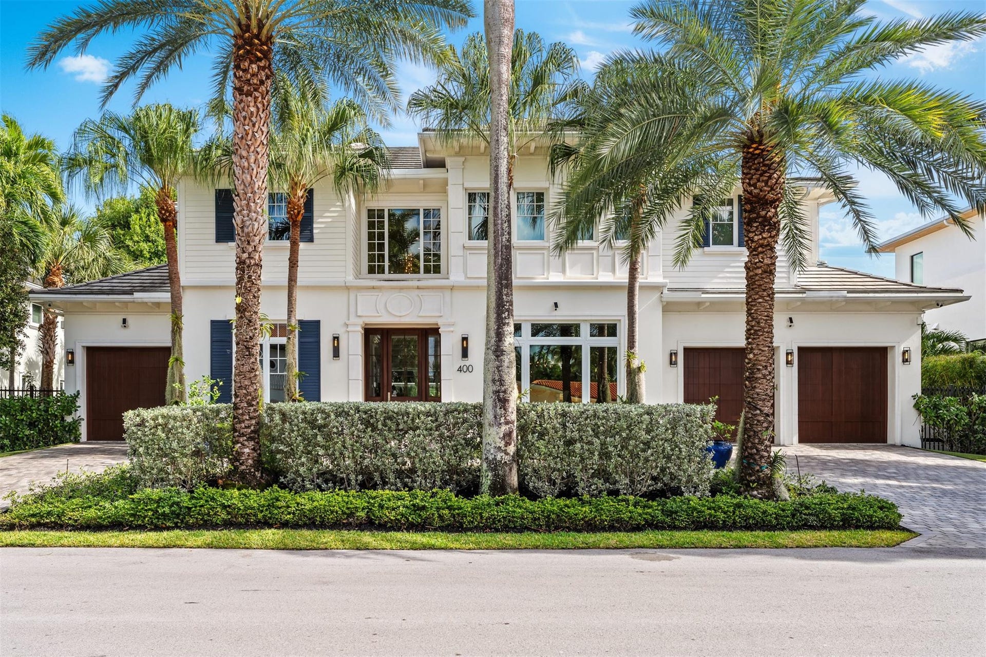 Beautifully maintained front-facade with 3 car garage and additional space for parking and guests.
