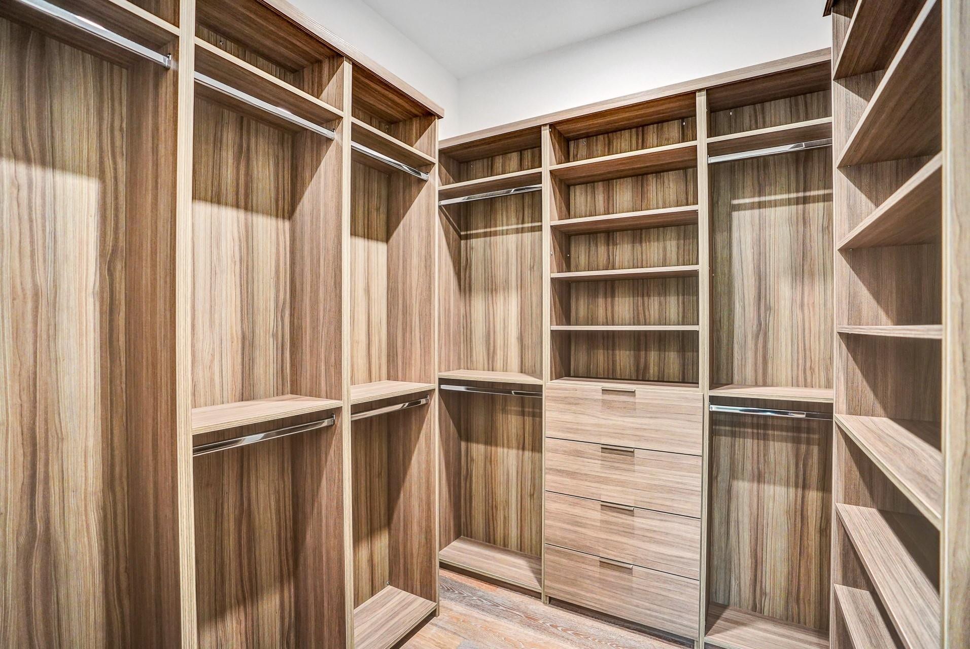 Guest bedrooms are complete with walk-in closets.