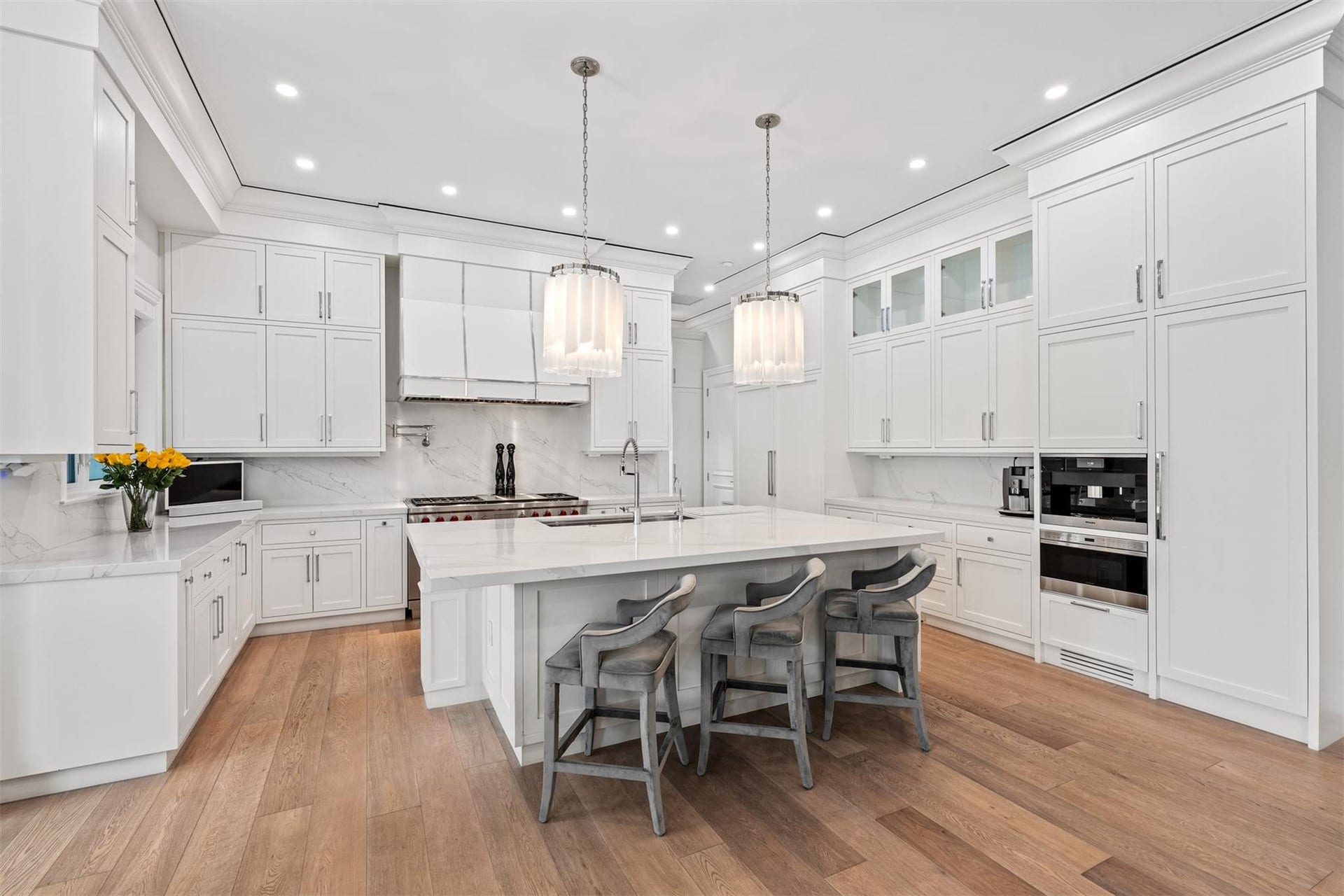 A chef's dream! Equipped with Sub-Zero and Wolf appliances. Overlook your main living space while eating and cooking.