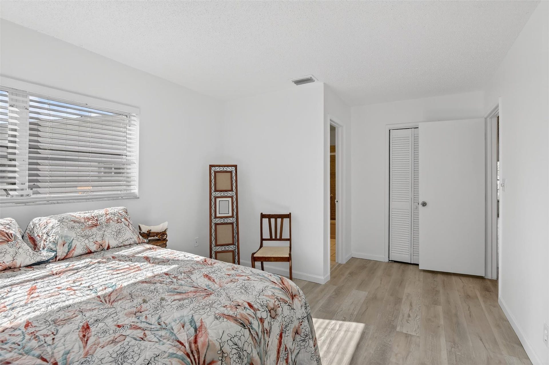 PRIMARY BEDROOM WITH WALK IN CLOSETS