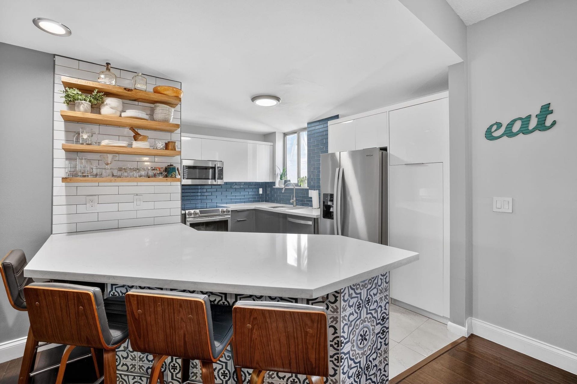 1401 NE 9th Street, #13, Fort Lauderdale, FL 33304 The updated kitchen offers quarts countertops with an eat-at-bar for 4 that over looks the living/dining area.