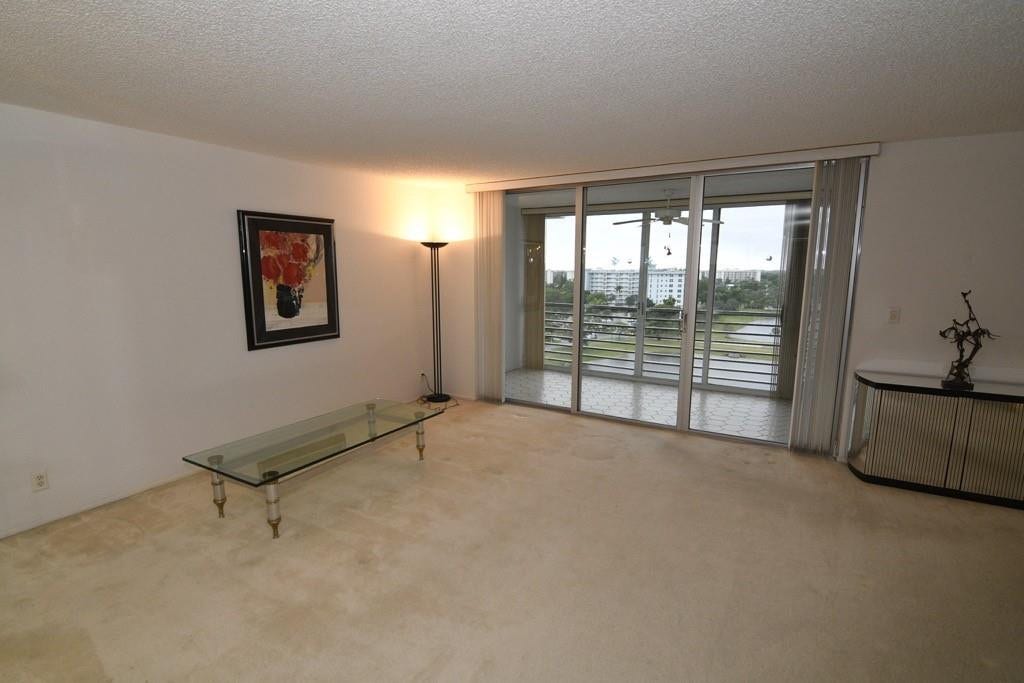 3095 N N Course, #1008, Pompano Beach, FL 33069 Sliders to balcony, there is Hurricane Accordion shutter on Liv Rm & Primary