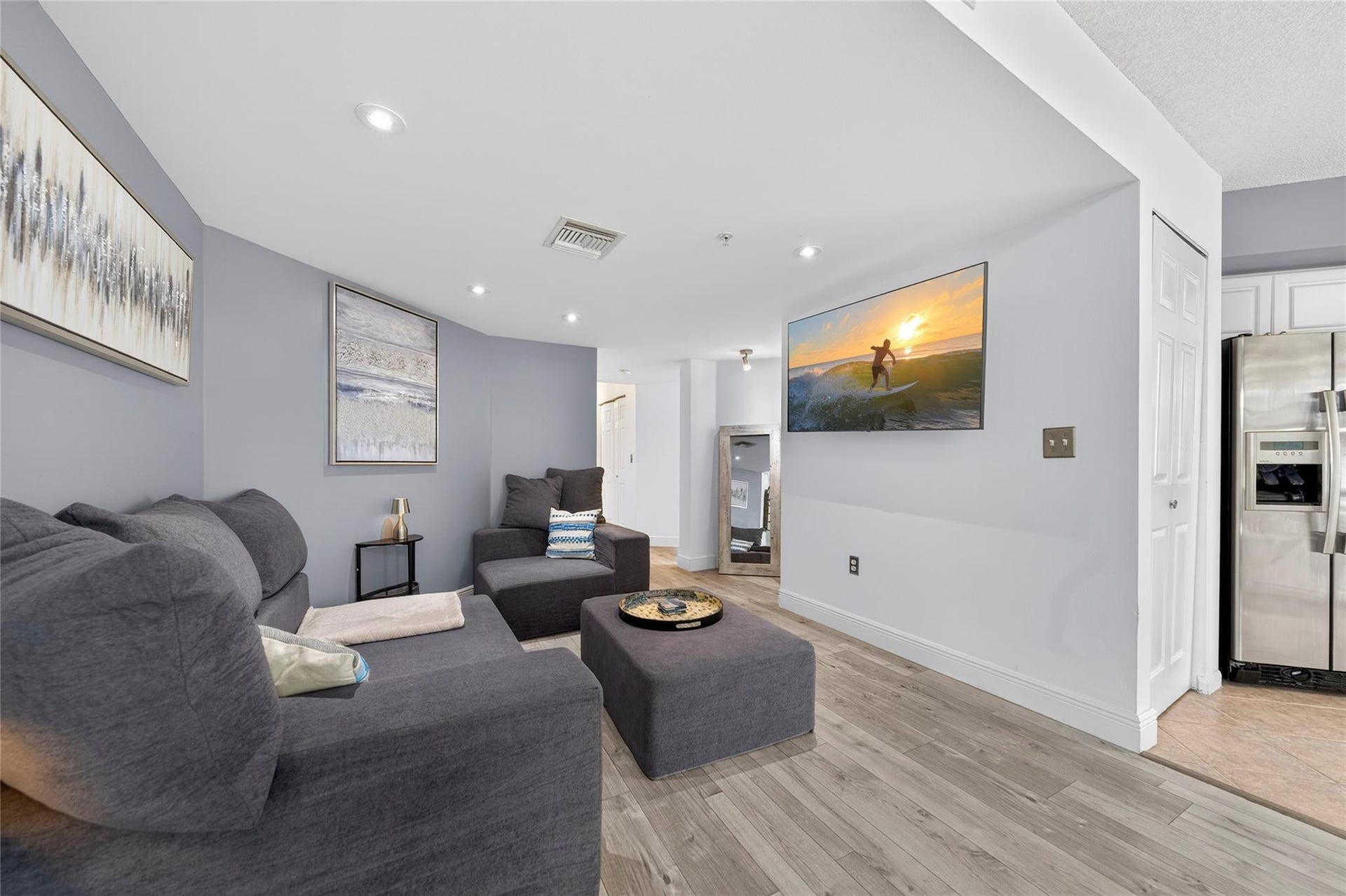 520 SE 5th Avenue, #2404, Fort Lauderdale, FL 33301 Spacious living room with an open layout, abundant natural light, and seamless flow to the dining areaideal for relaxing or entertaining.