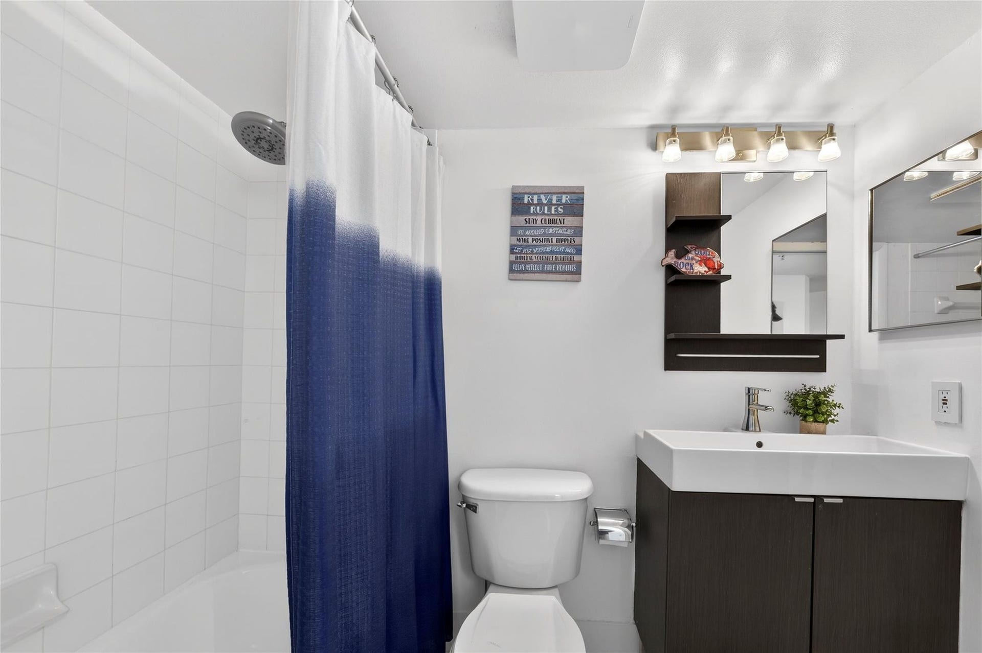 520 SE 5th Avenue, #2404, Fort Lauderdale, FL 33301 Modern bathroom features upgraded vanity, sleek fixtures, and clean contemporary finishes for a fresh, updated feel.