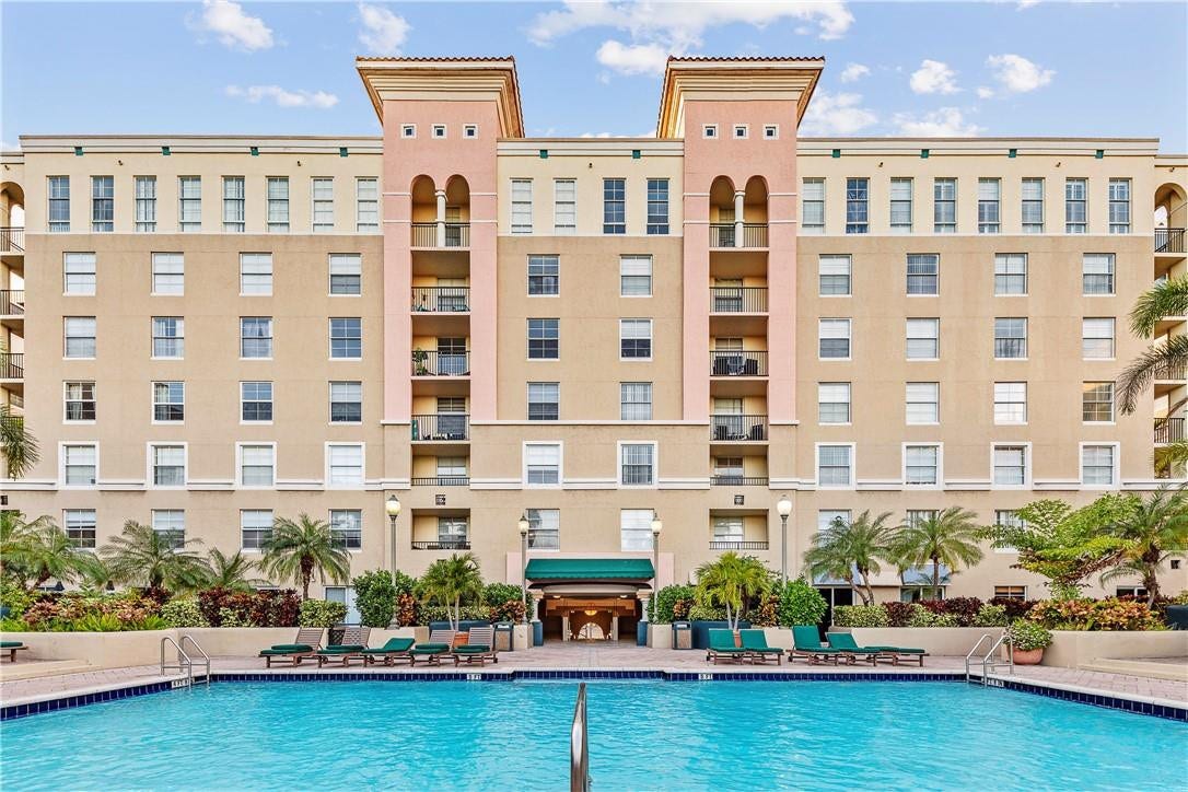 520 SE 5th Avenue, #2404, Fort Lauderdale, FL 33301 Stunning pool area surrounded by lush landscaping, featuring cabanas, a hot tub, shower, and more for ultimate relaxation.