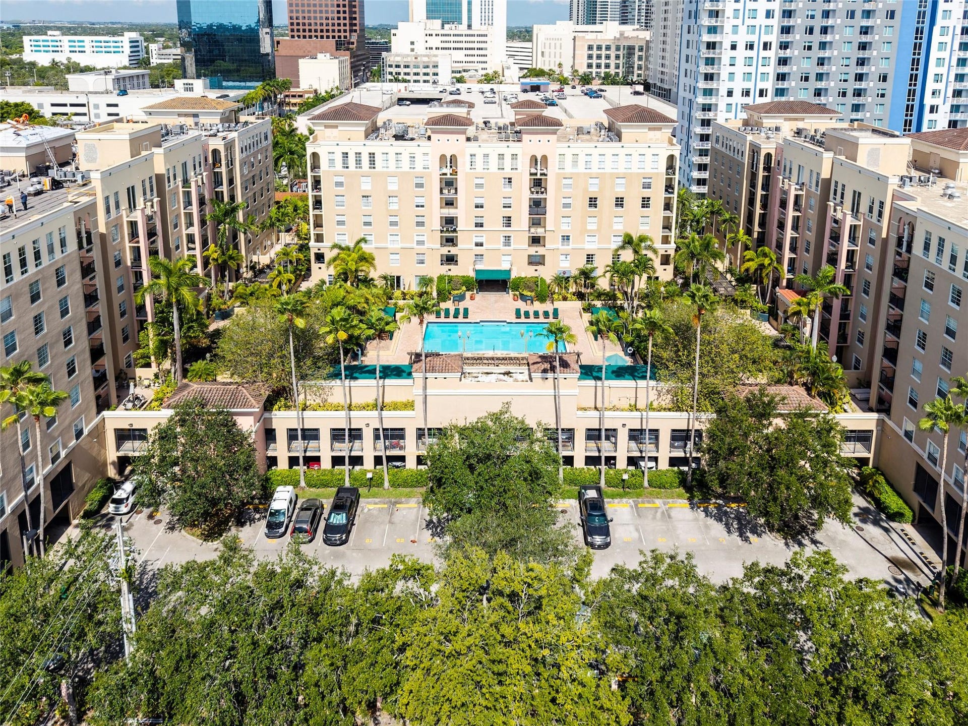 520 SE 5th Avenue, #2404, Fort Lauderdale, FL 33301 Stunning pool area surrounded by lush landscaping, featuring cabanas, a hot tub, shower, and more for ultimate relaxation.
