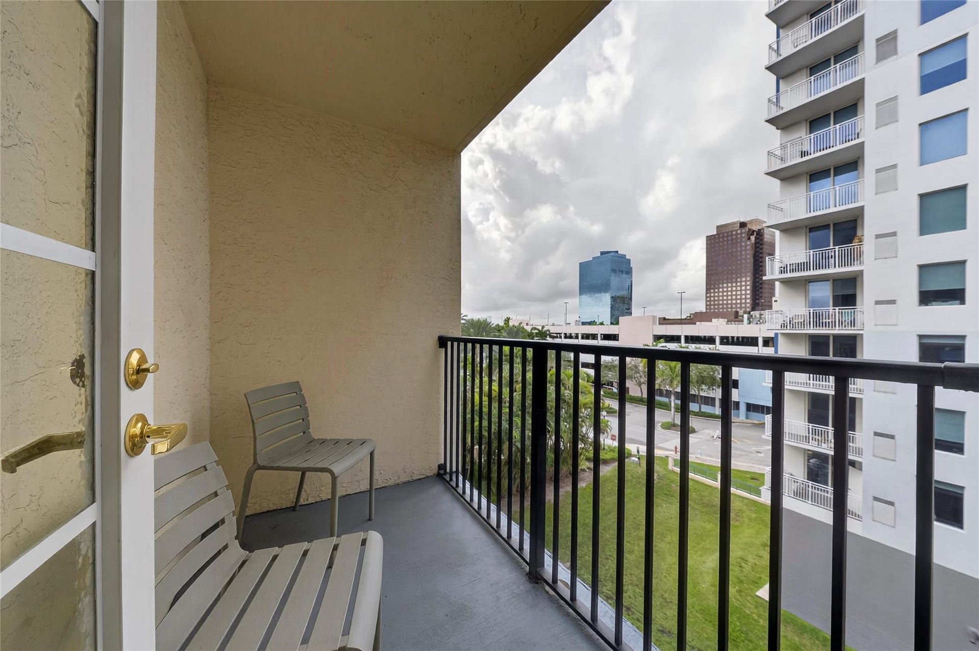 520 SE 5th Avenue, #2404, Fort Lauderdale, FL 33301 Private patio off the primary bedroom offers treetop views and a quiet outdoor space to relax and unwind.