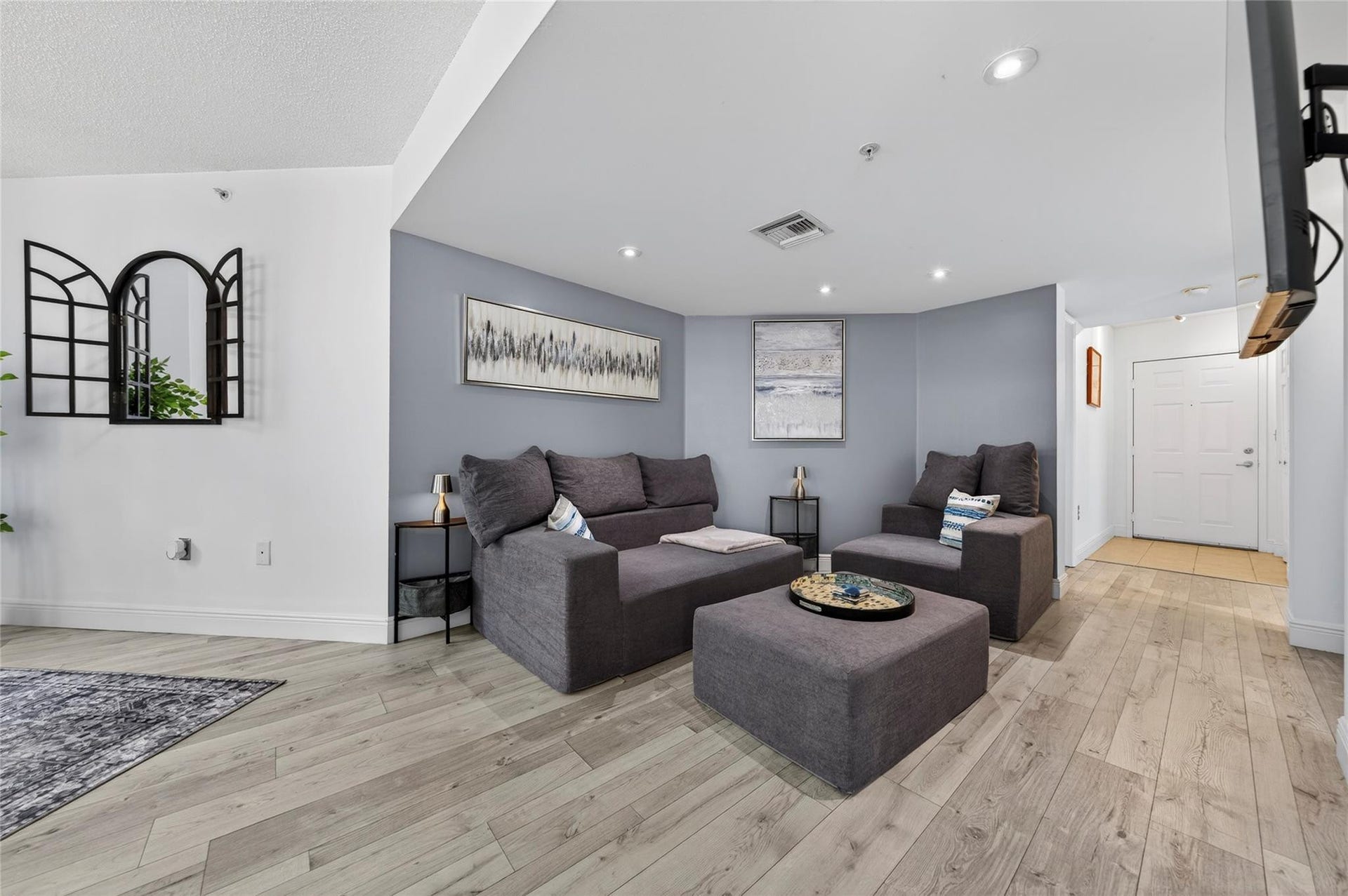520 SE 5th Avenue, #2404, Fort Lauderdale, FL 33301 Spacious living room with an open layout, abundant natural light, and seamless flow to the dining areaideal for relaxing or entertaining.
