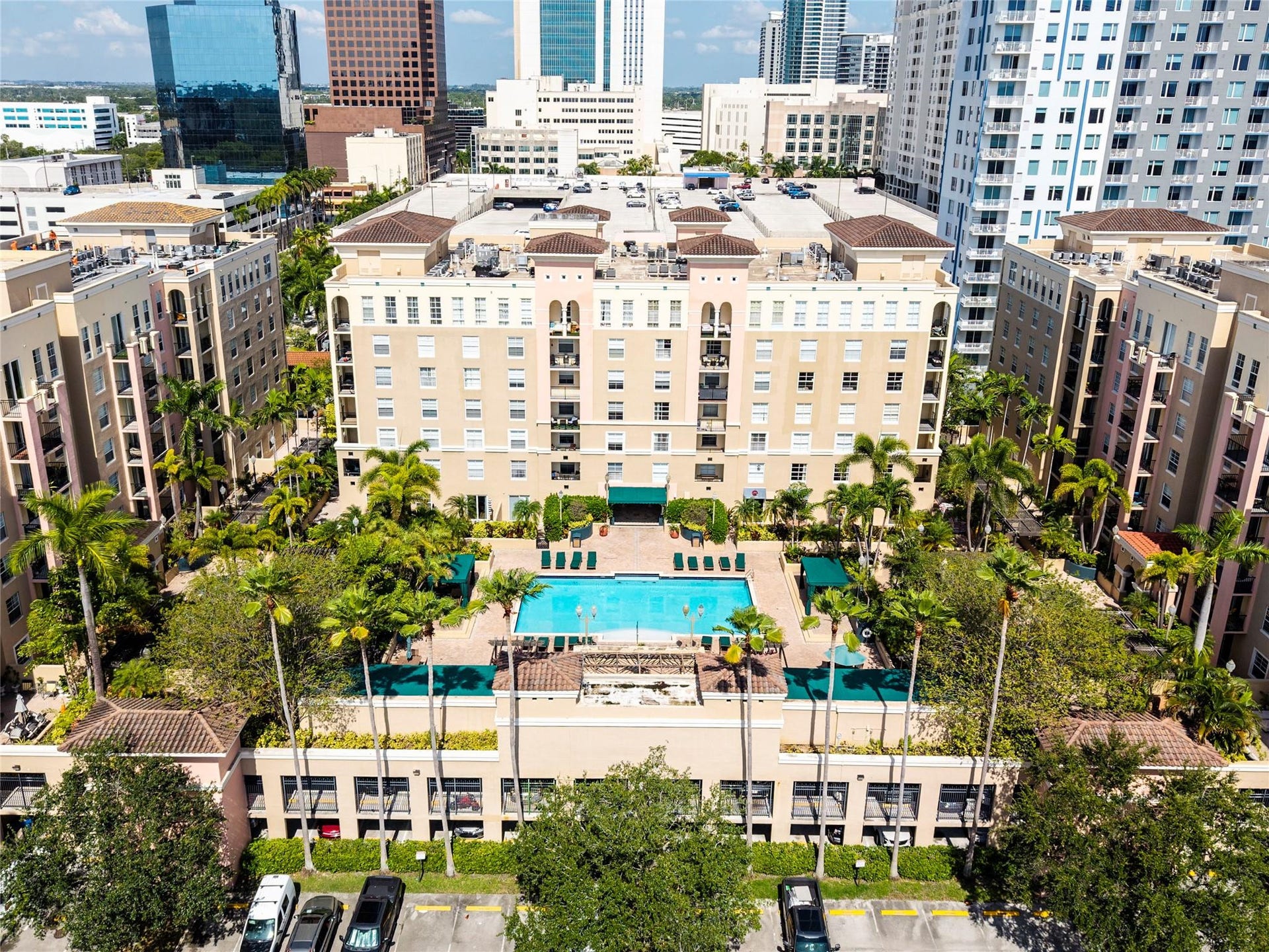520 SE 5th Avenue, #2404, Fort Lauderdale, FL 33301 Stunning pool area surrounded by lush landscaping, featuring cabanas, a hot tub, shower, and more for ultimate relaxation.