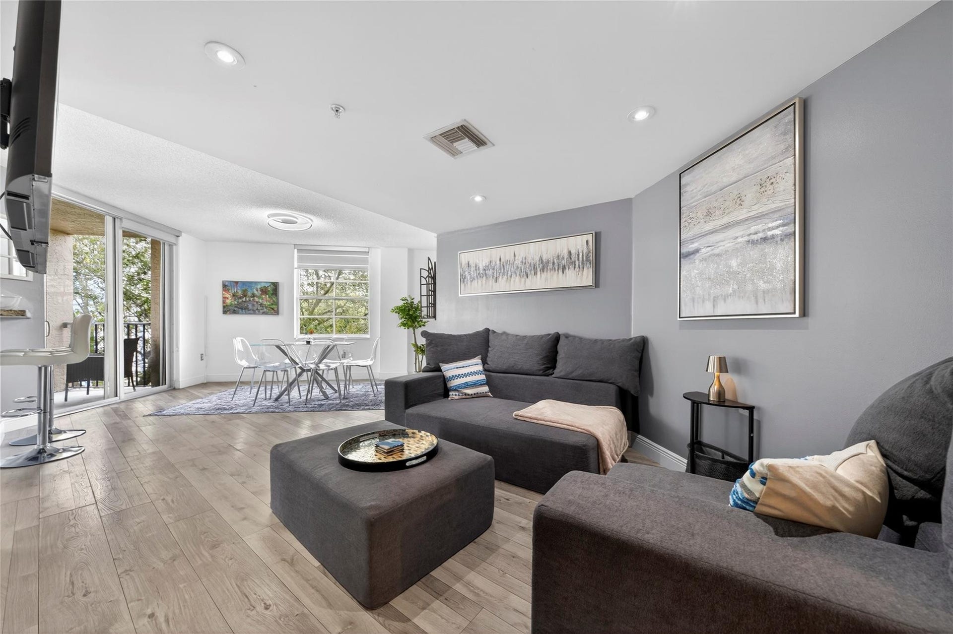 520 SE 5th Avenue, #2404, Fort Lauderdale, FL 33301 Spacious living room with an open layout, abundant natural light, and seamless flow to the dining areaideal for relaxing or entertaining.