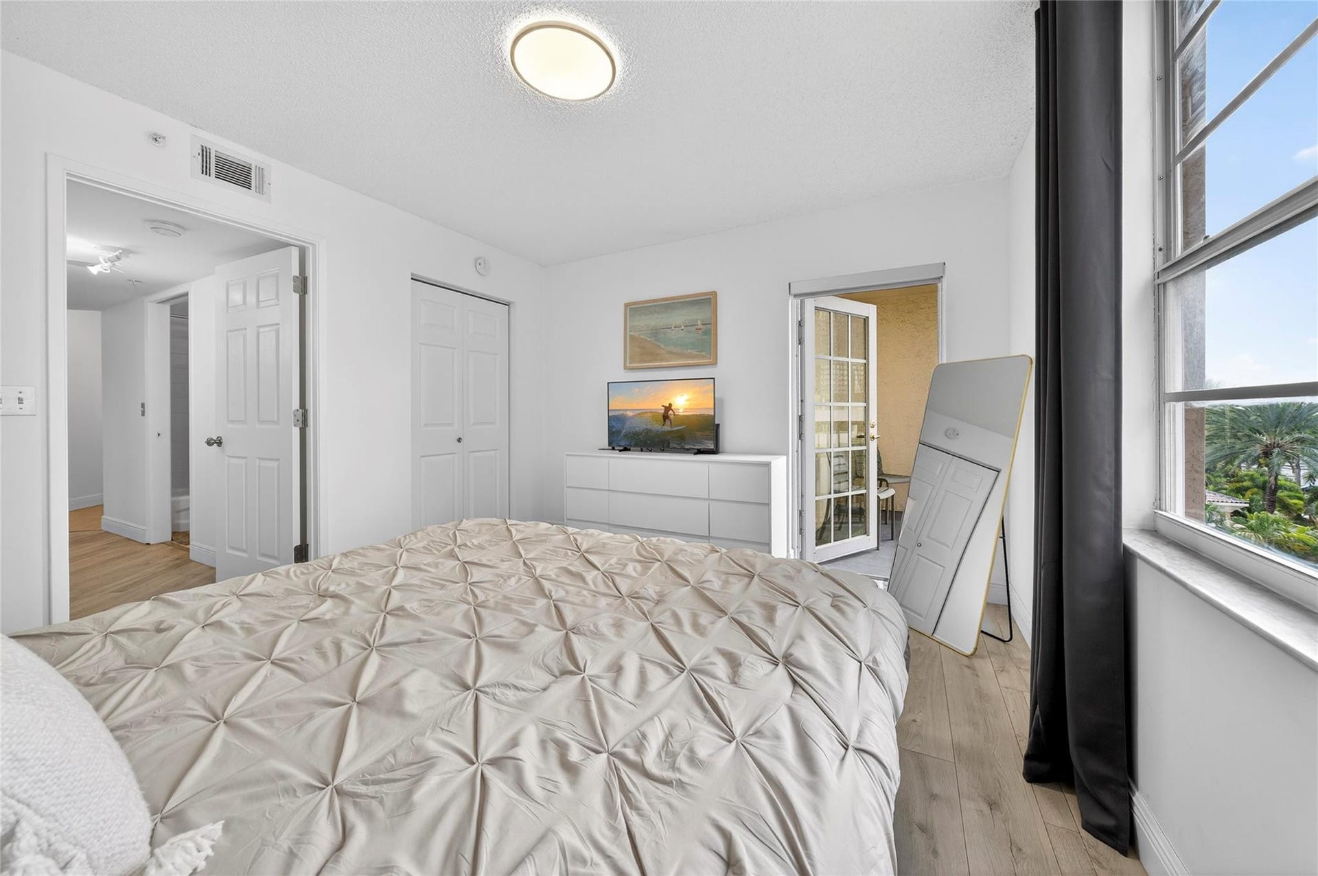 520 SE 5th Avenue, #2404, Fort Lauderdale, FL 33301 Spacious primary suite features a private patio and a recently remodeled en-suite bathroom, creating a peaceful and comfortable retreat.