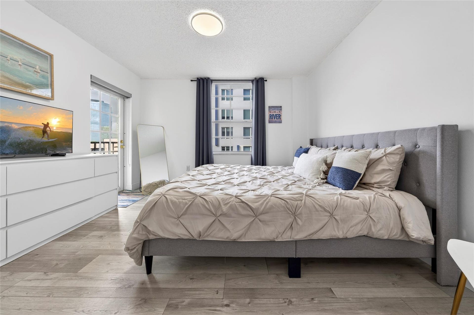 520 SE 5th Avenue, #2404, Fort Lauderdale, FL 33301 Spacious primary suite features a private patio and a recently remodeled en-suite bathroom, creating a peaceful and comfortable retreat.