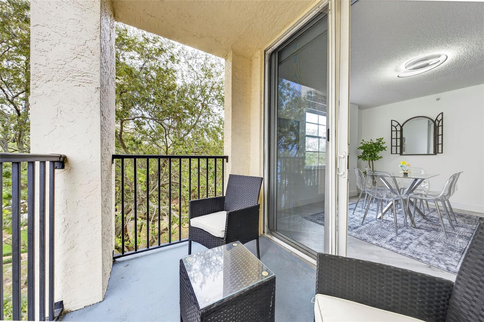520 SE 5th Avenue, #2404, Fort Lauderdale, FL 33301 Private primary patio offers a peaceful retreat with leafy treetop viewsperfect for morning coffee or unwinding in the evening.